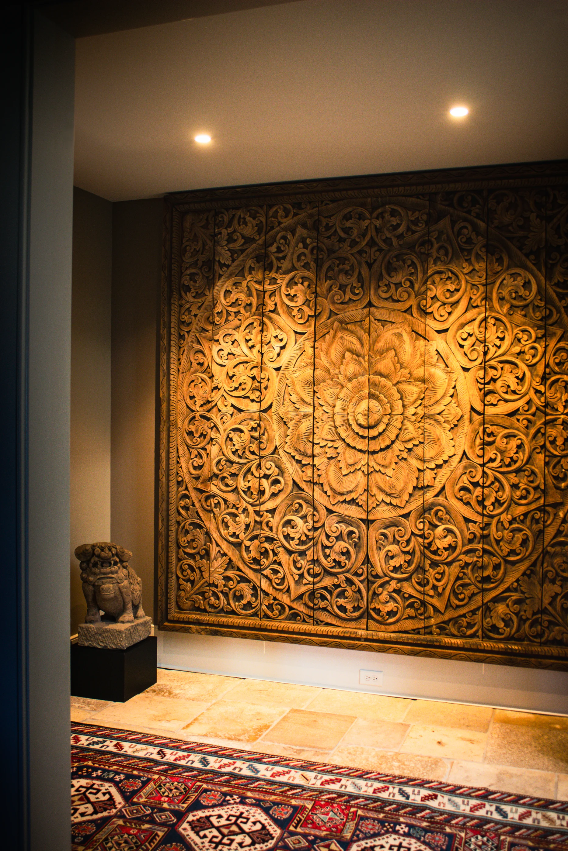 Carved decorative panel at the end of a gallery at Equestrian Estate.