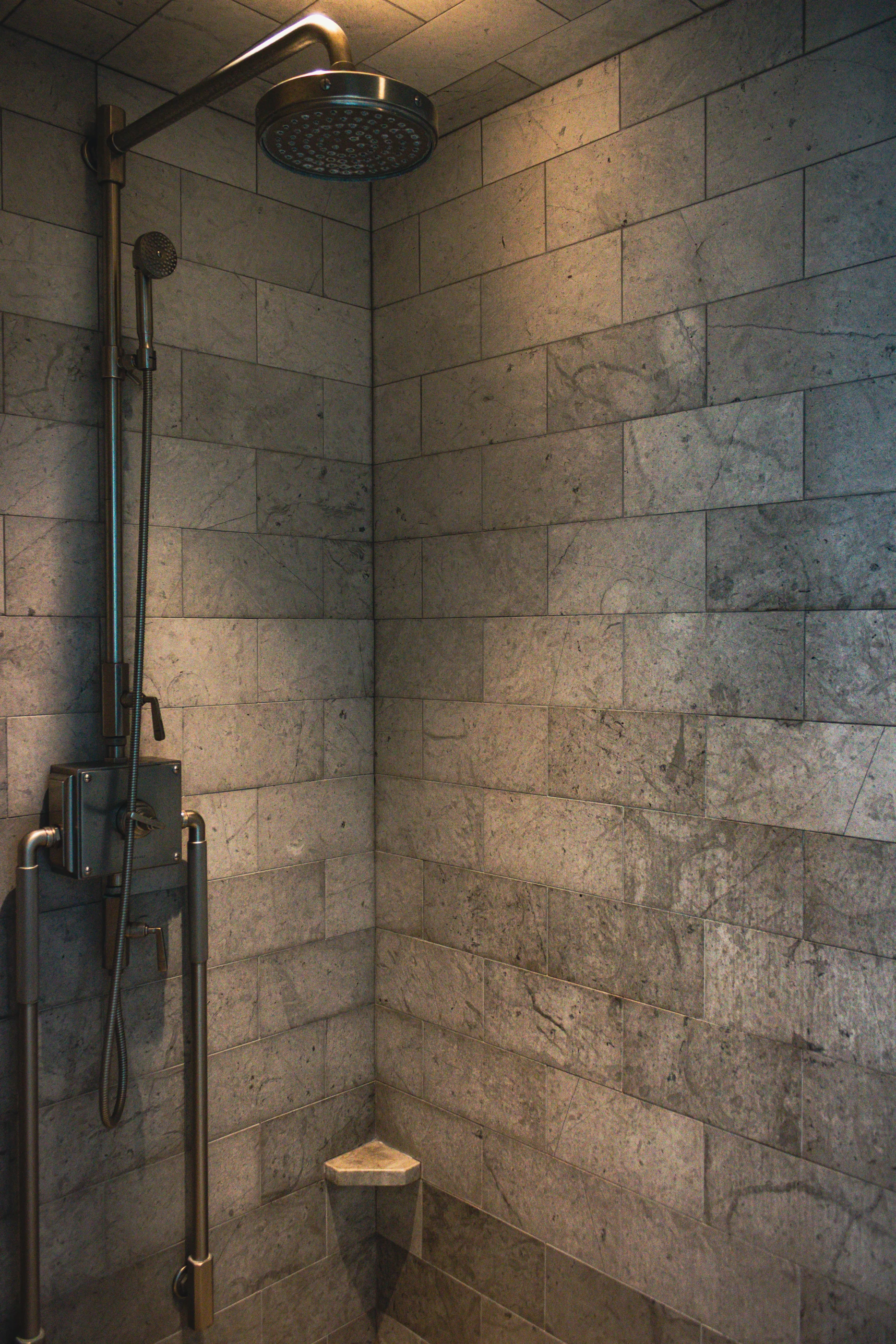 Stone shower with traditional fittings at Equestrian Estate.