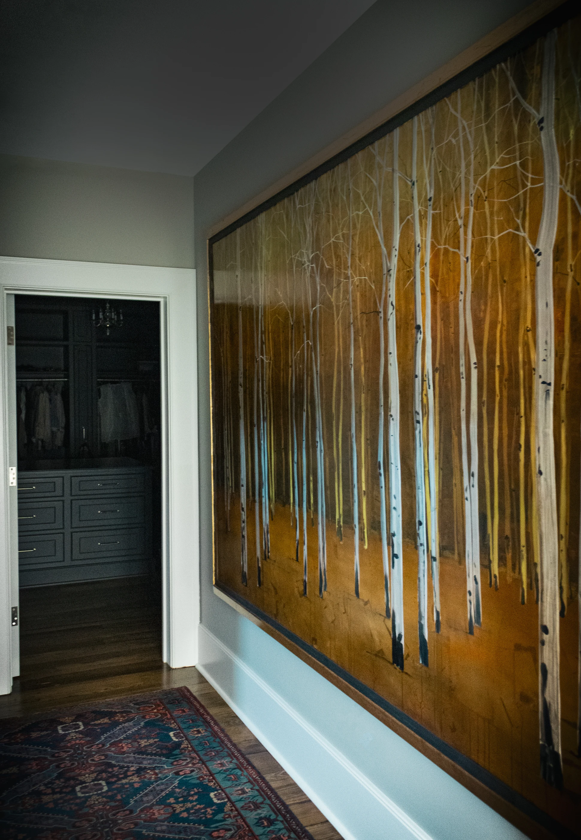 Landscape painting in a layered interior passage at Equestrian Estate.