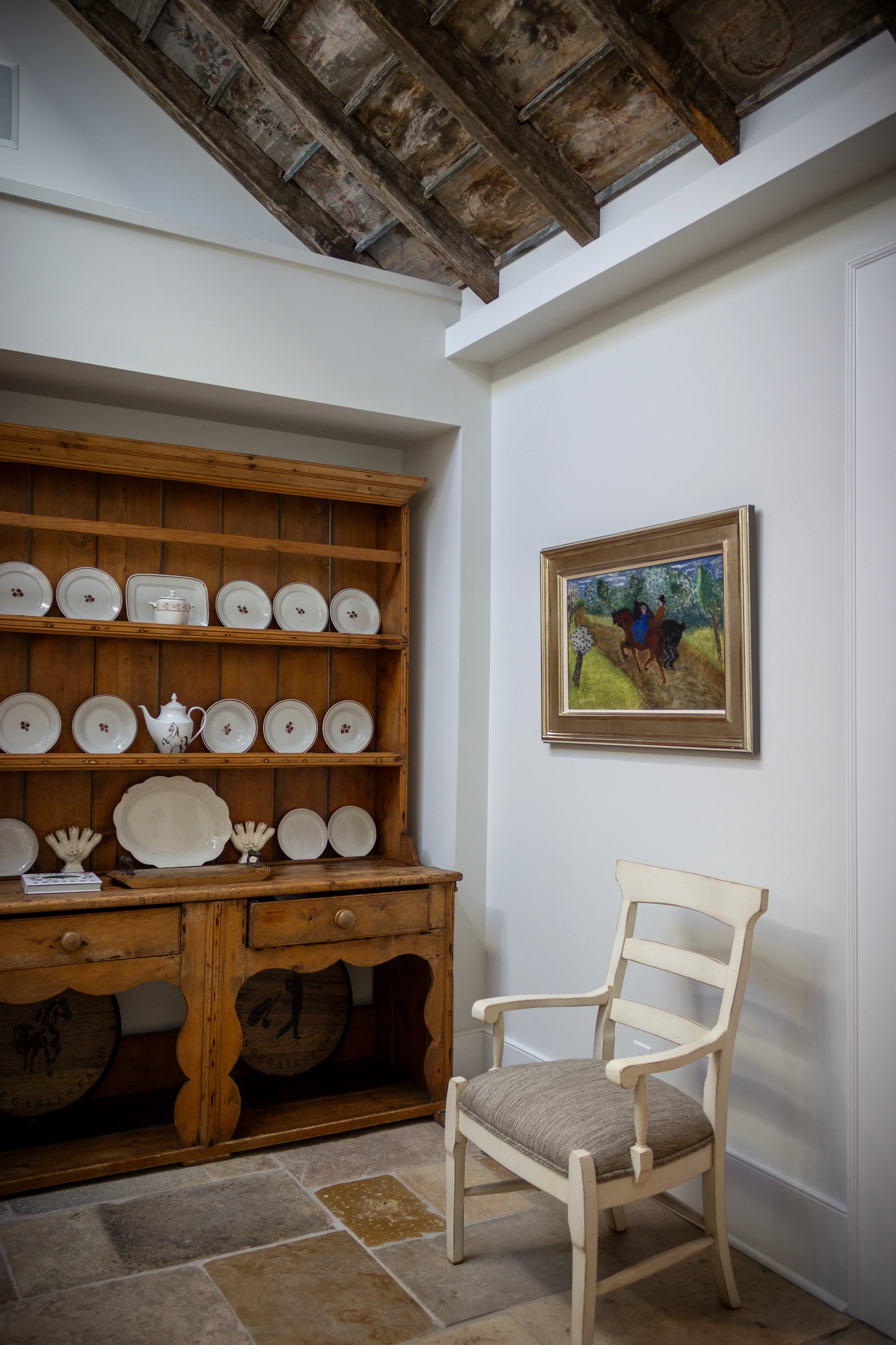 Antique dresser, ceramics and painted ceiling at Equestrian Estate.