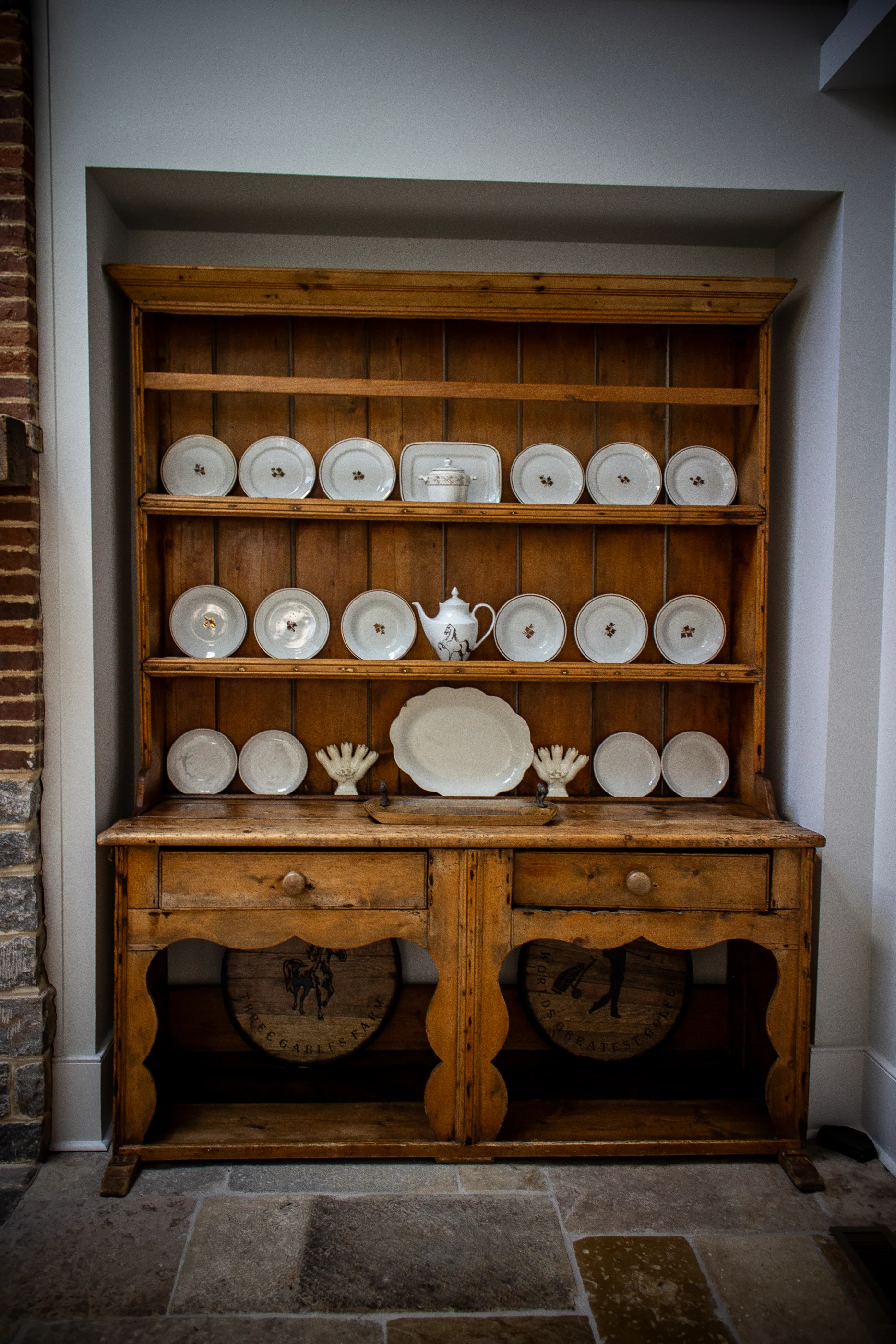 Collected ceramics on an antique timber dresser at Equestrian Estate.