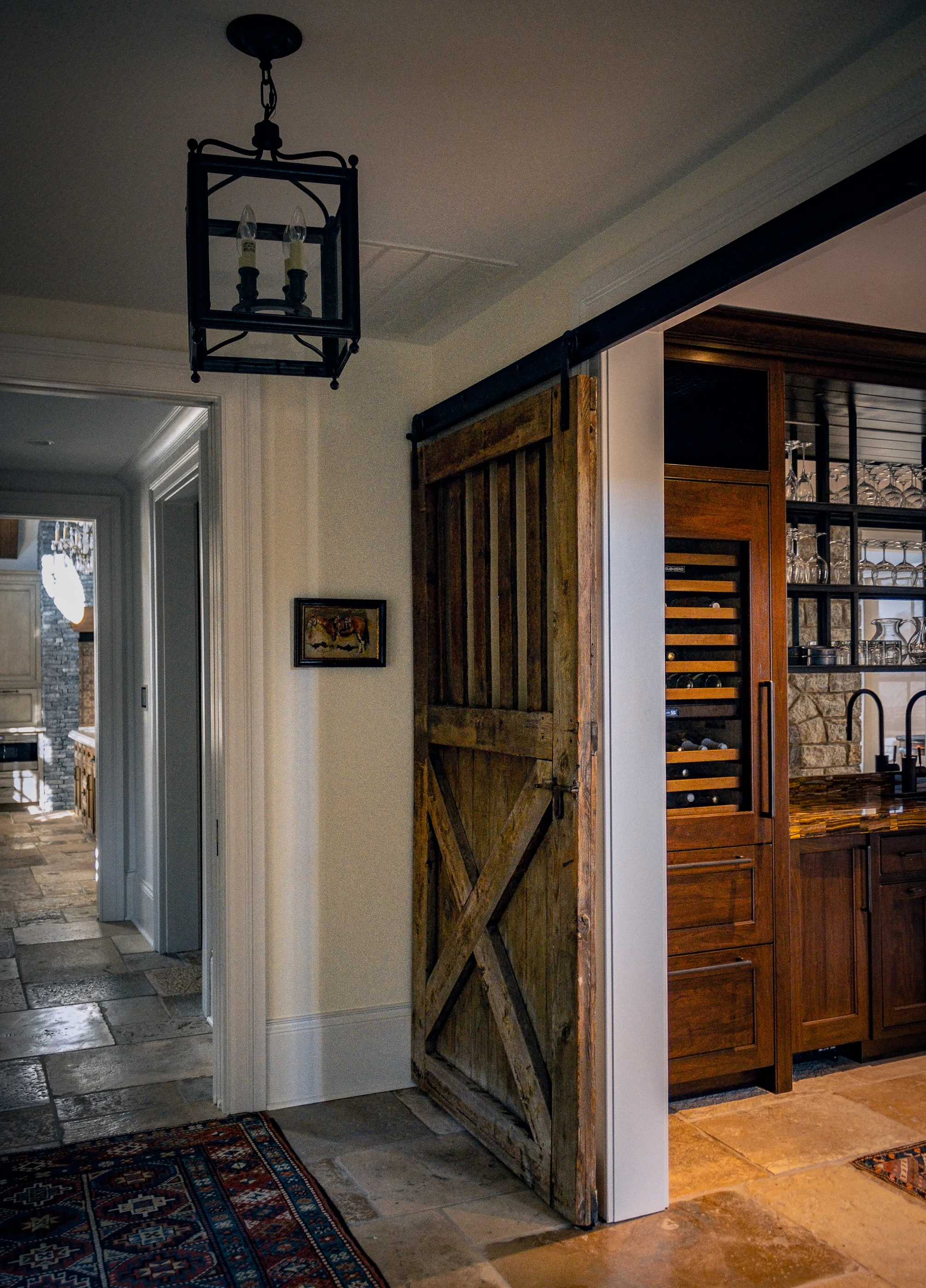 Sliding timber door opening to the wine bar at Equestrian Estate.