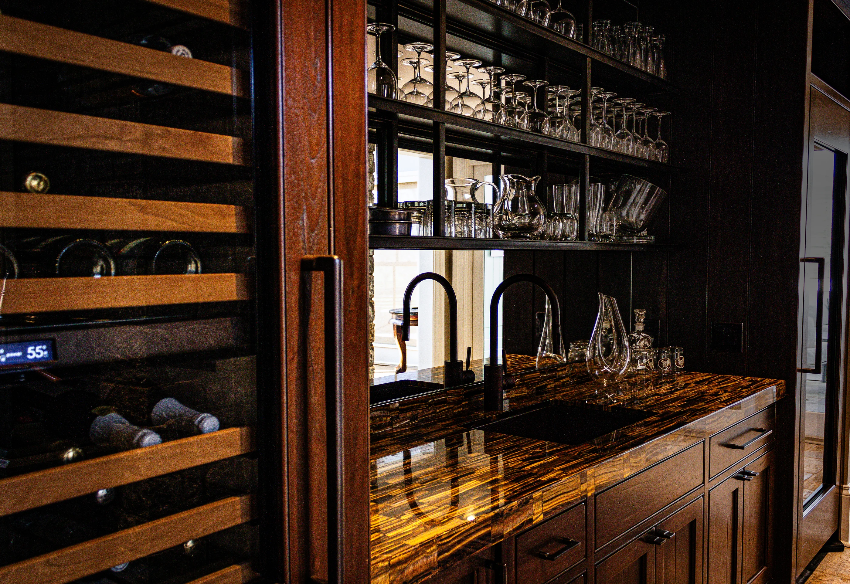 Rich timber wine bar with dramatic stone countertop at Equestrian Estate.