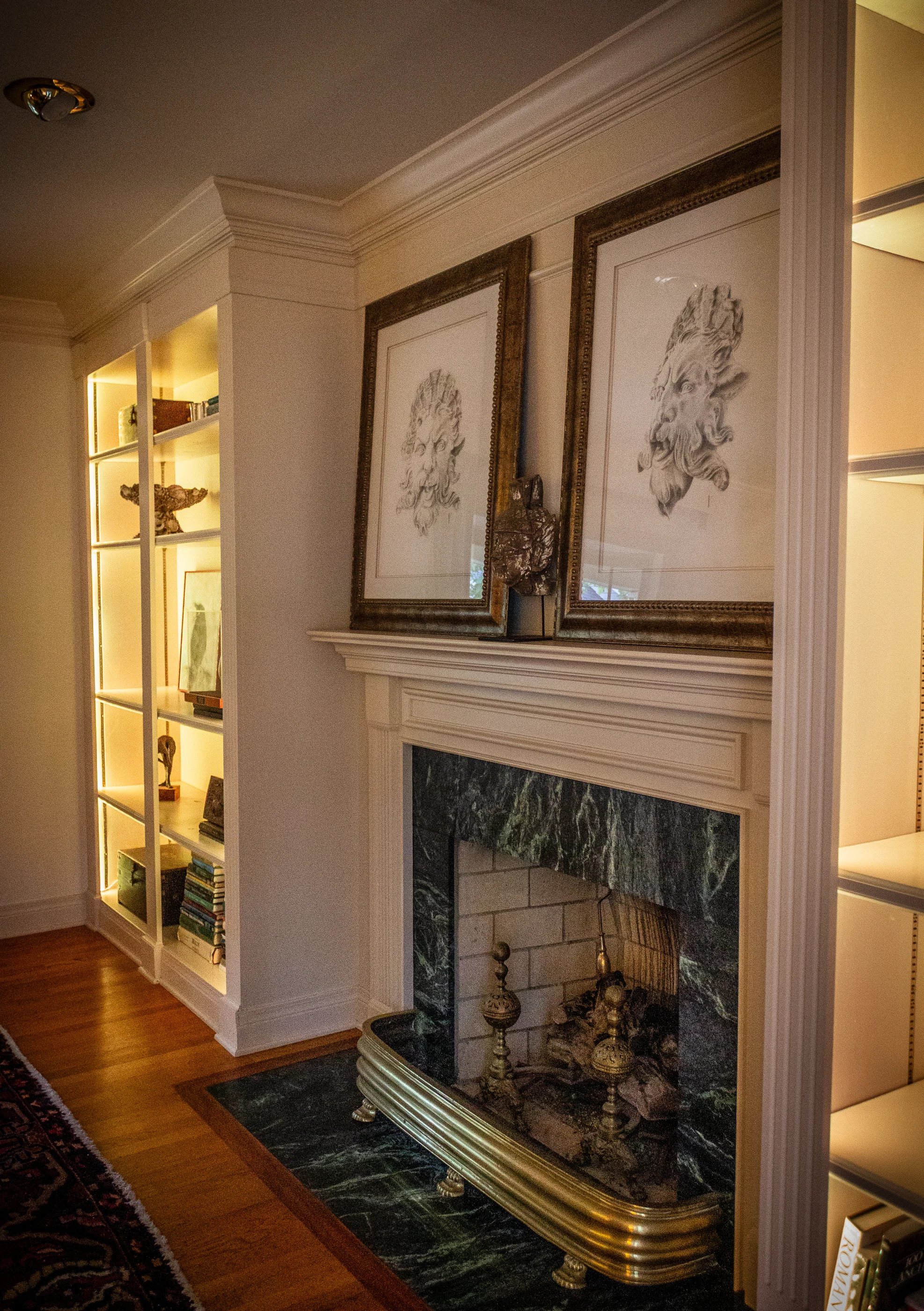 Marble fireplace and illuminated display shelves at Ashland Park.