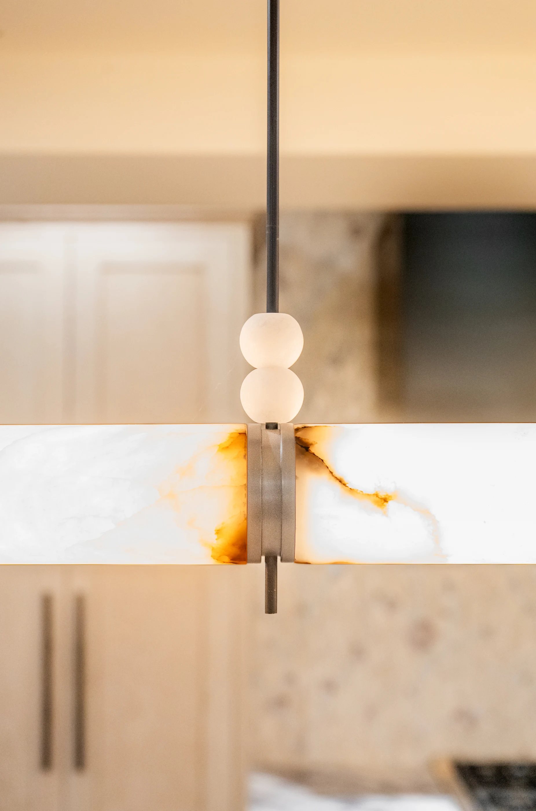 Sculptural pendant lighting above the kitchen at Hart Townhouse.