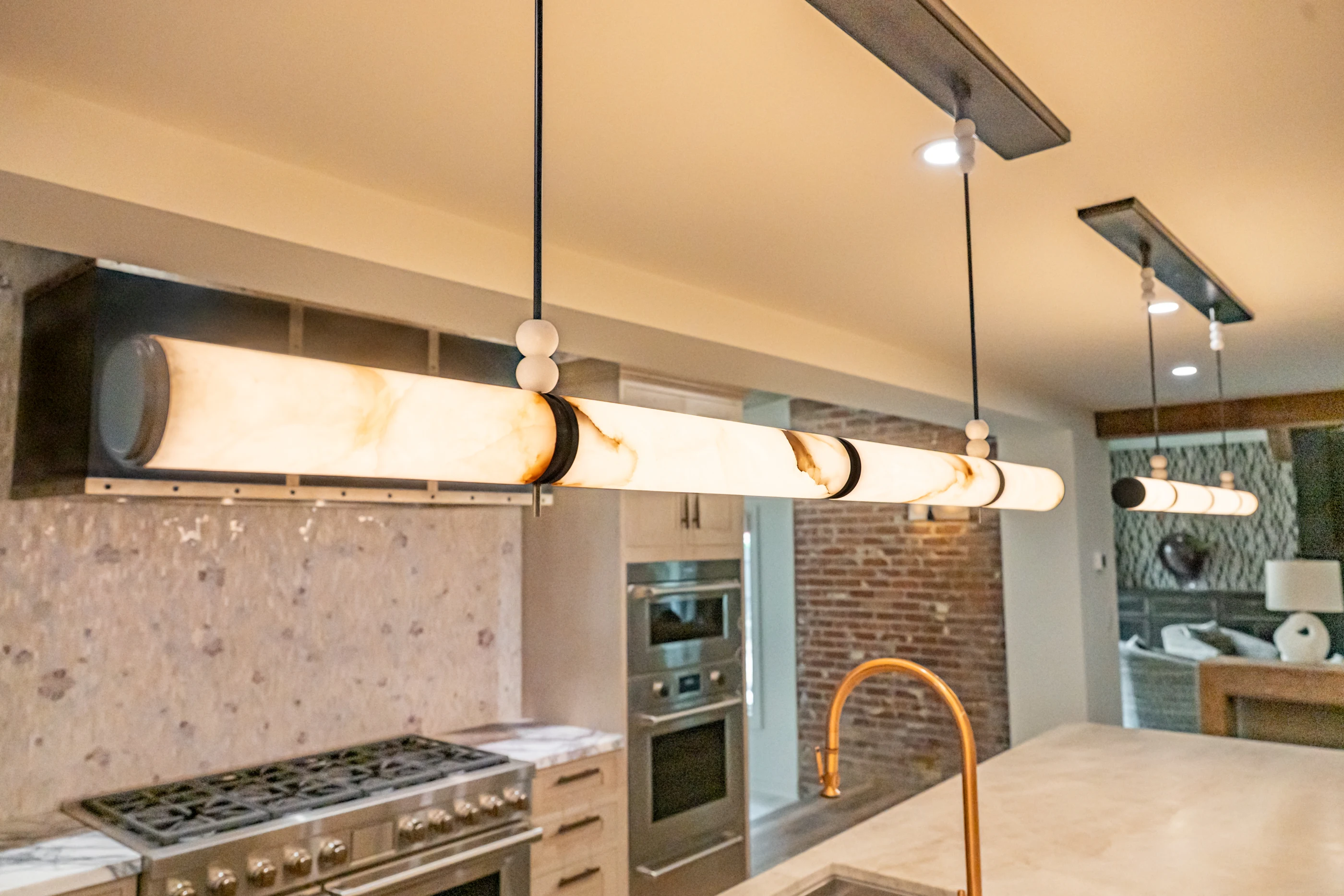 Kitchen lighting and mosaic range wall at Hart Townhouse.