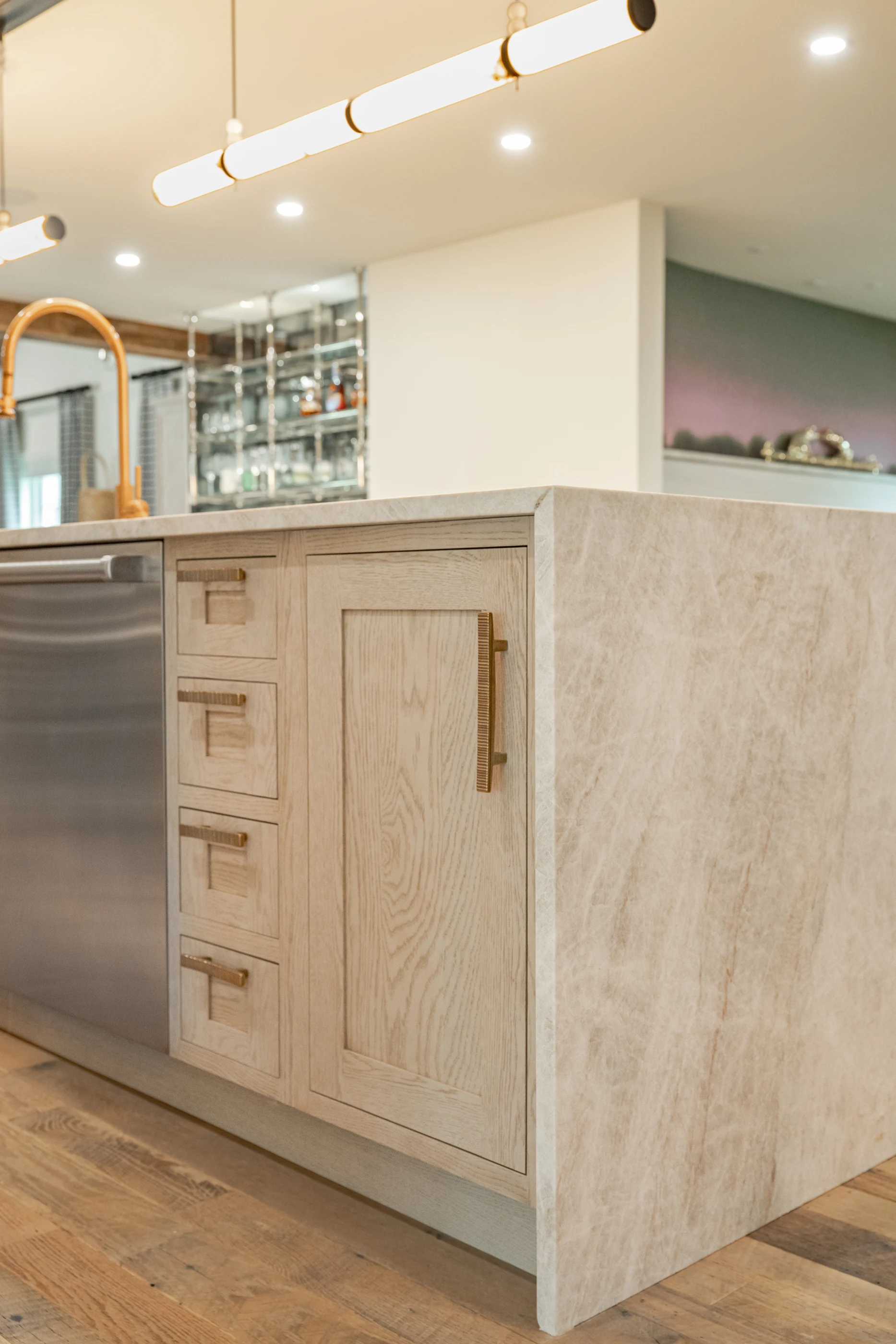 Waterfall stone island and pale cabinetry at Hart Townhouse.