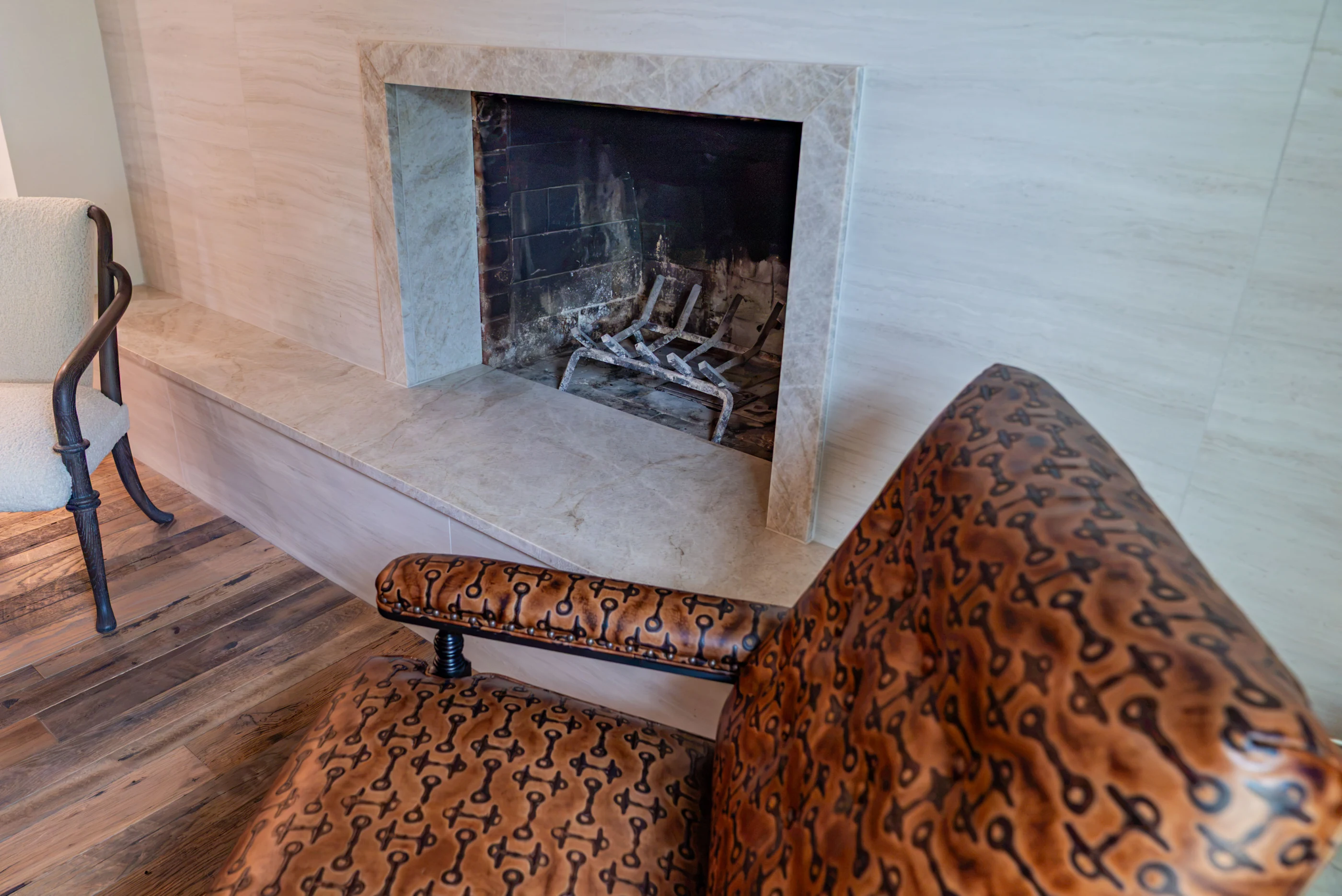 Chair and fireplace in the sitting room at Hart Townhouse.