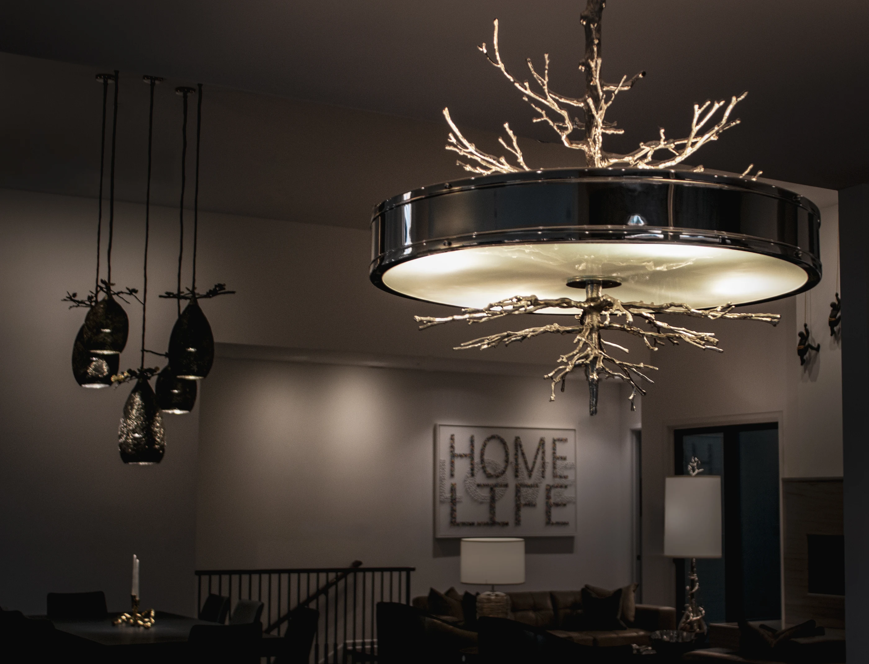 Branch-inspired chandelier above the living space at Urban Mod.