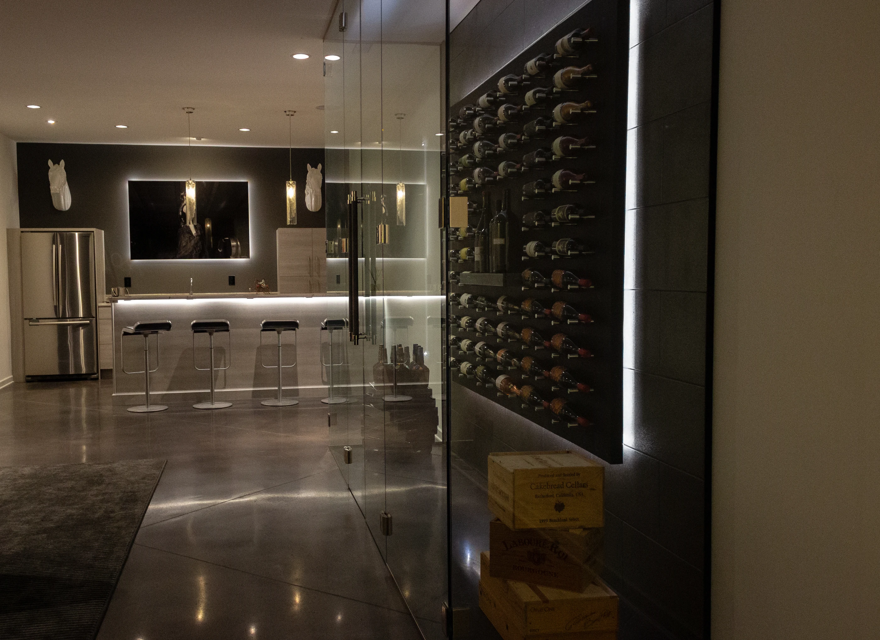 Glass-enclosed wine display and contemporary bar at Urban Mod.