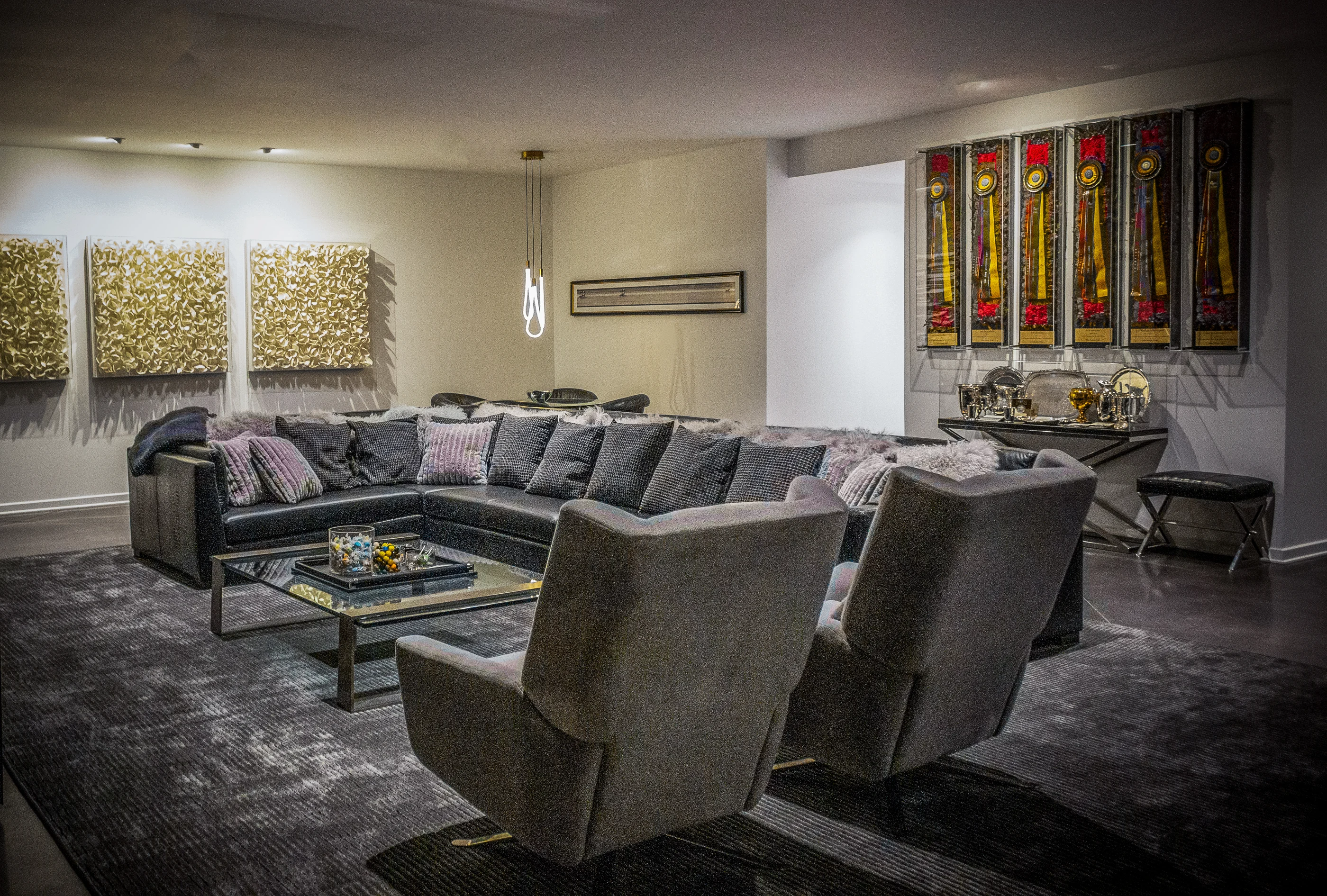 Lounge with layered seating and expressive artwork at Urban Mod.