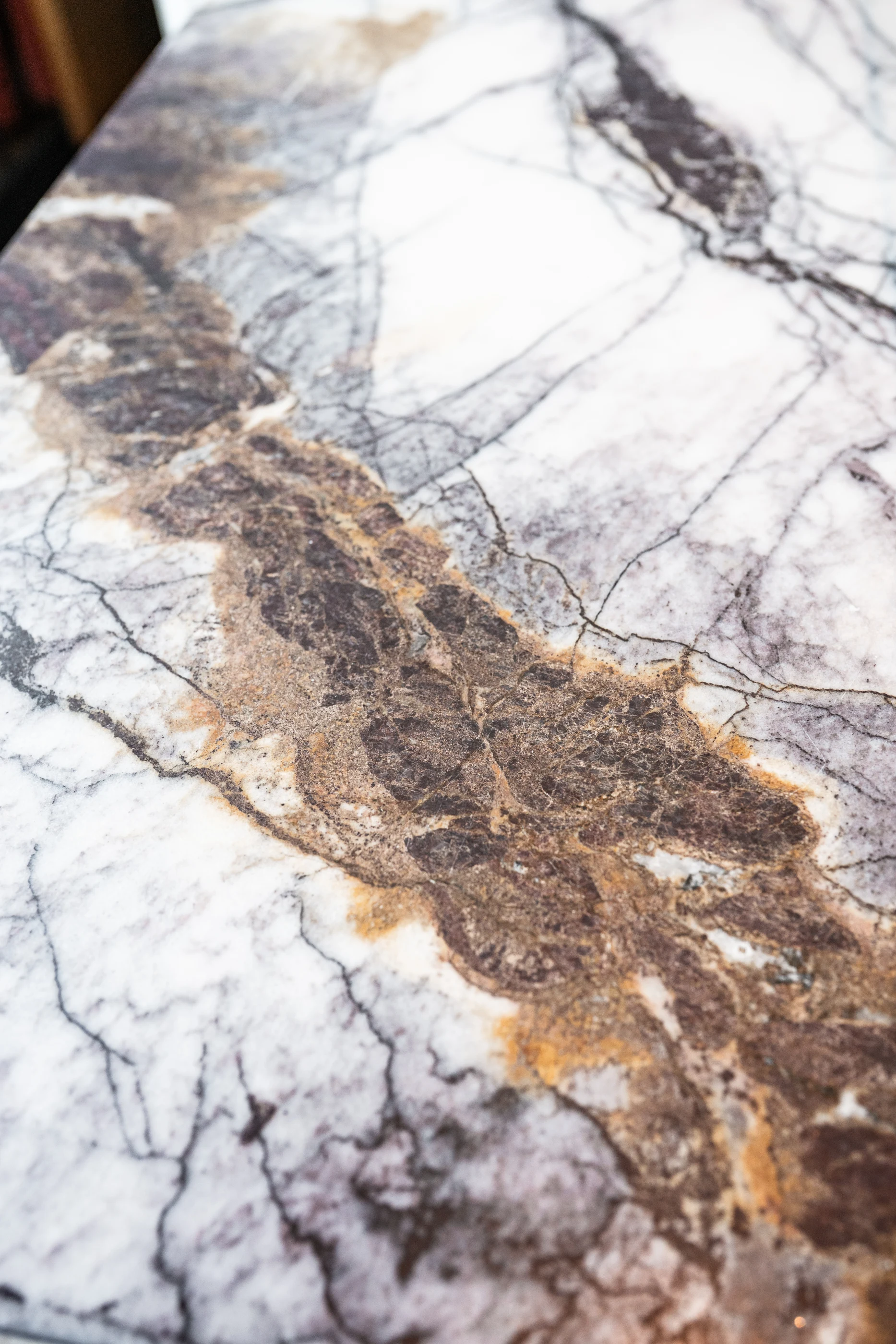 Natural stone veining and texture in the Cabinet & Stone Lab showroom.