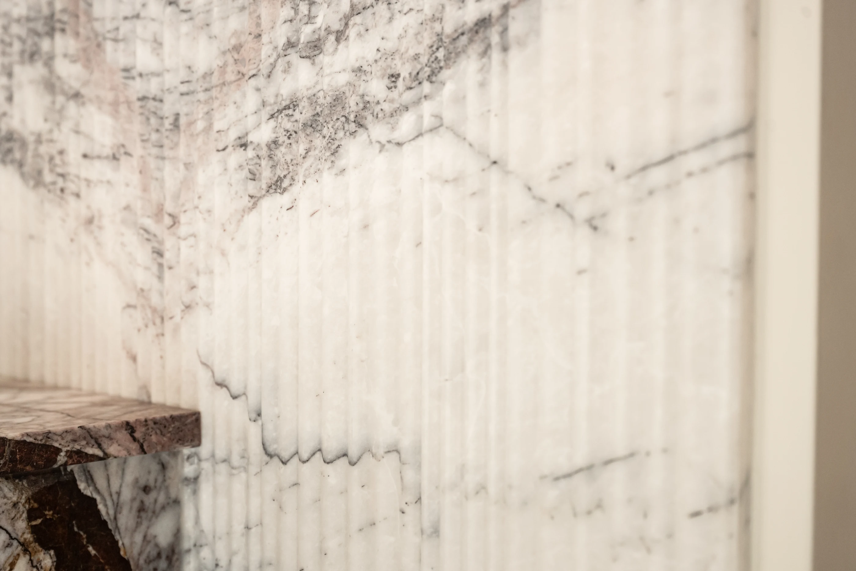 Expressive veining in the stone wall at Hart Townhouse.