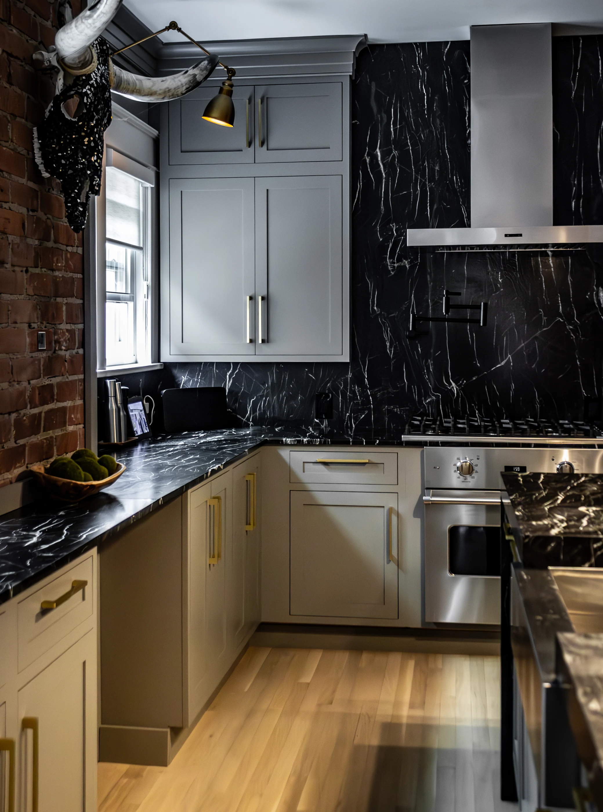 Kitchen cabinetry and stone range wall at Chevy Chase.