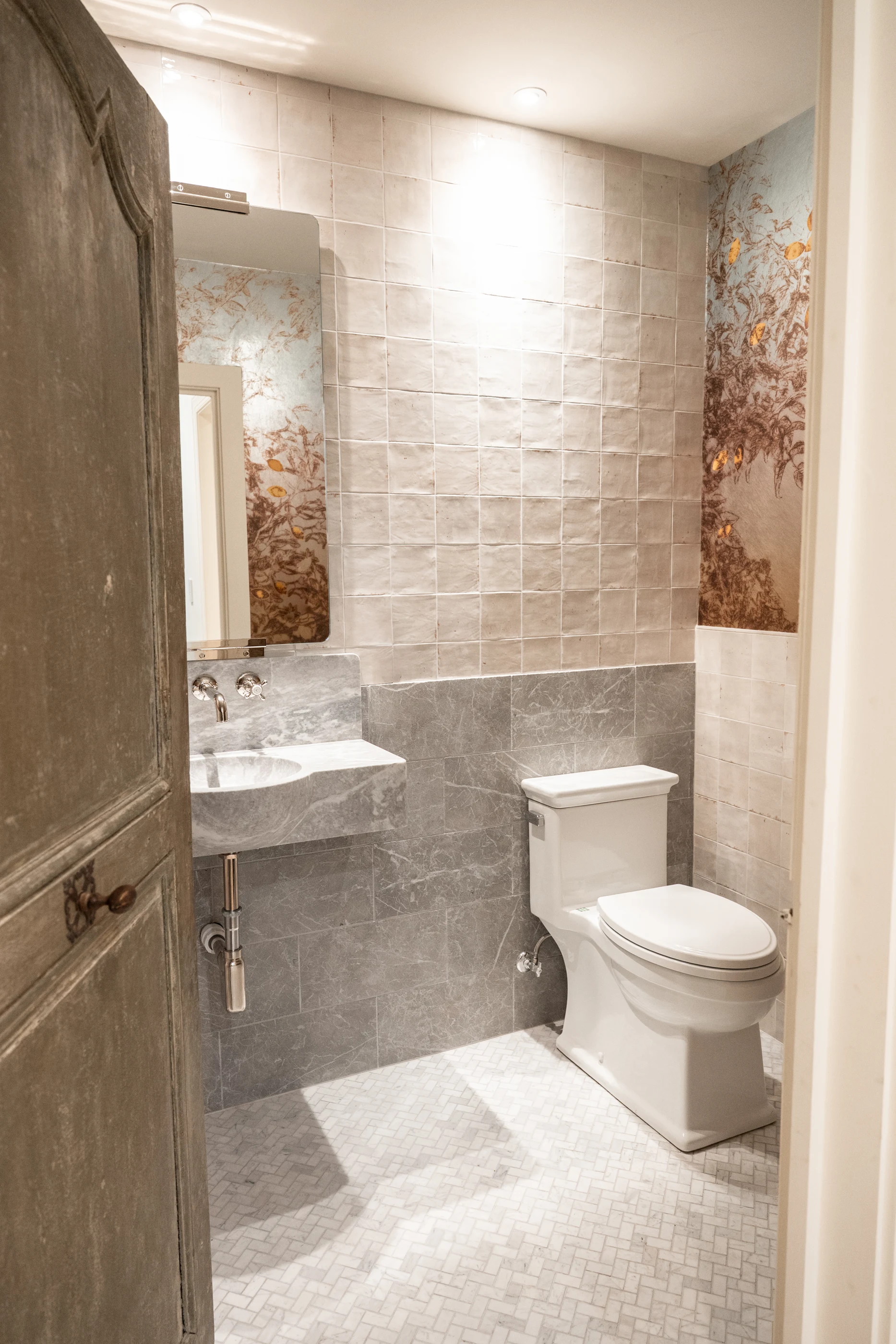 Bathroom with a sculptural stone vanity at Hart Townhouse.