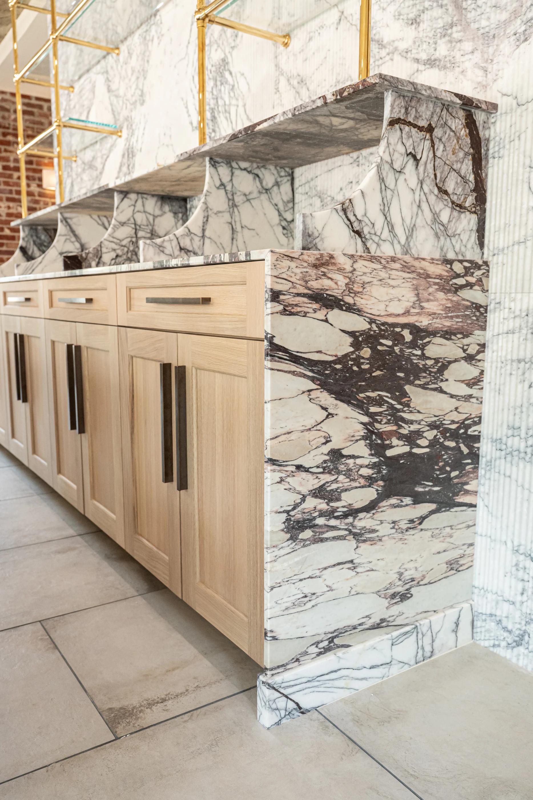 Veined stone countertop and cabinet detail at Hart Townhouse.