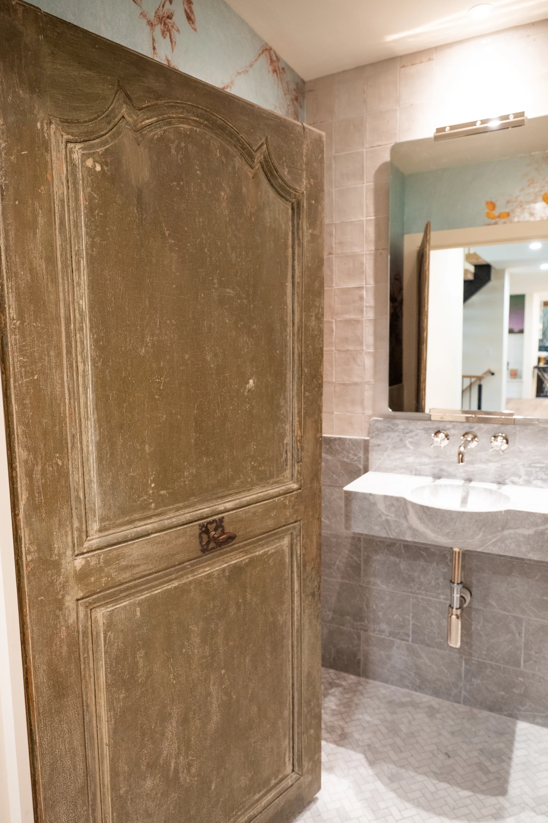 Antique timber door opening to the vanity at Hart Townhouse.