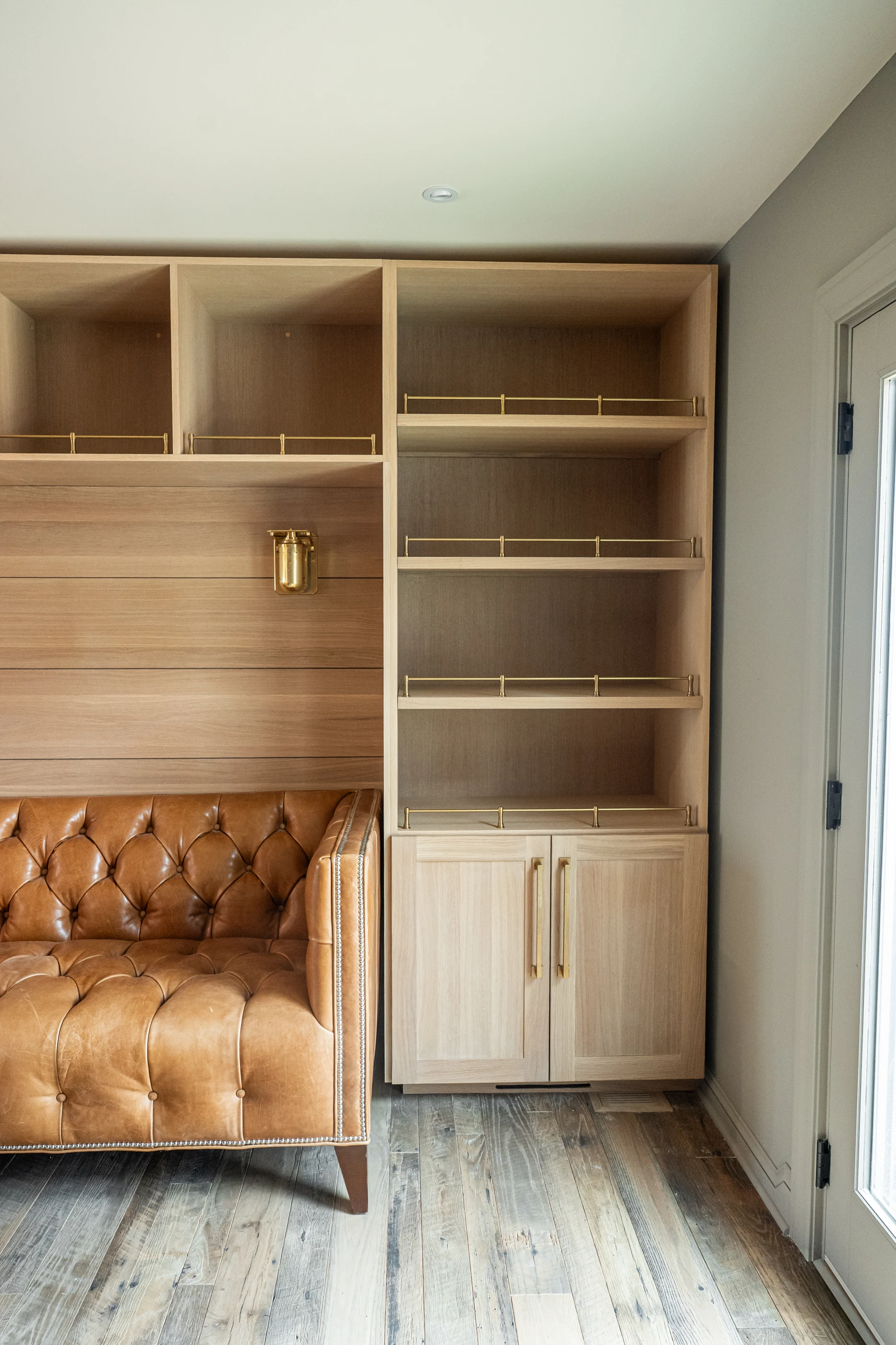 Leather banquette framed by timber built-ins at Hart Townhouse.