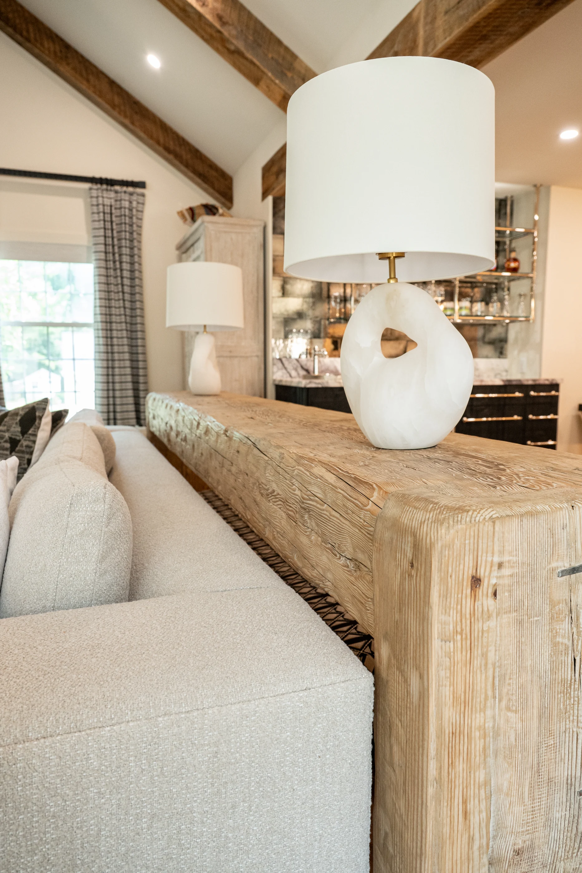 White ceramic lamp on a timber console at Hart Townhouse.