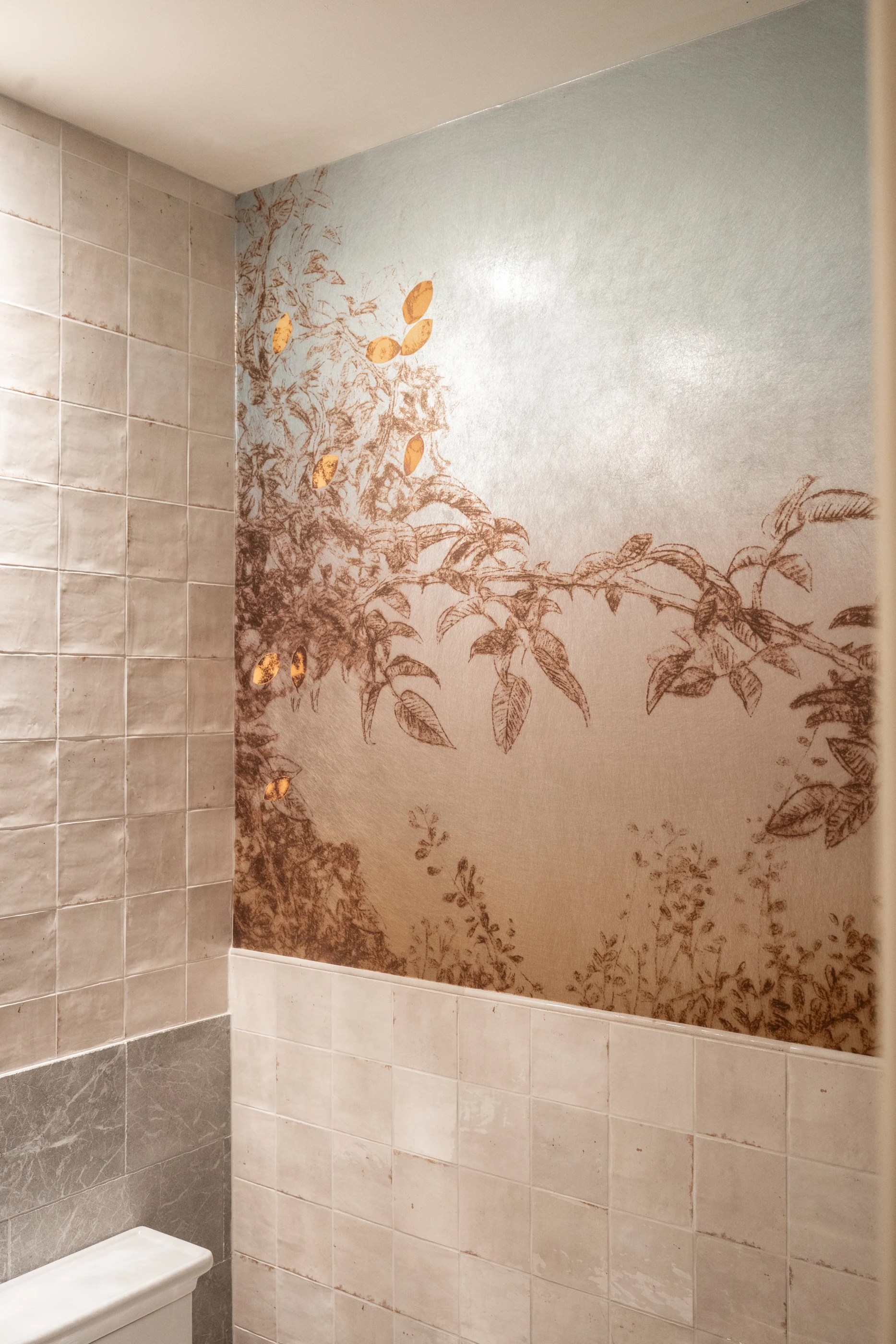 Scenic wallcovering beside veined stone at Hart Townhouse.