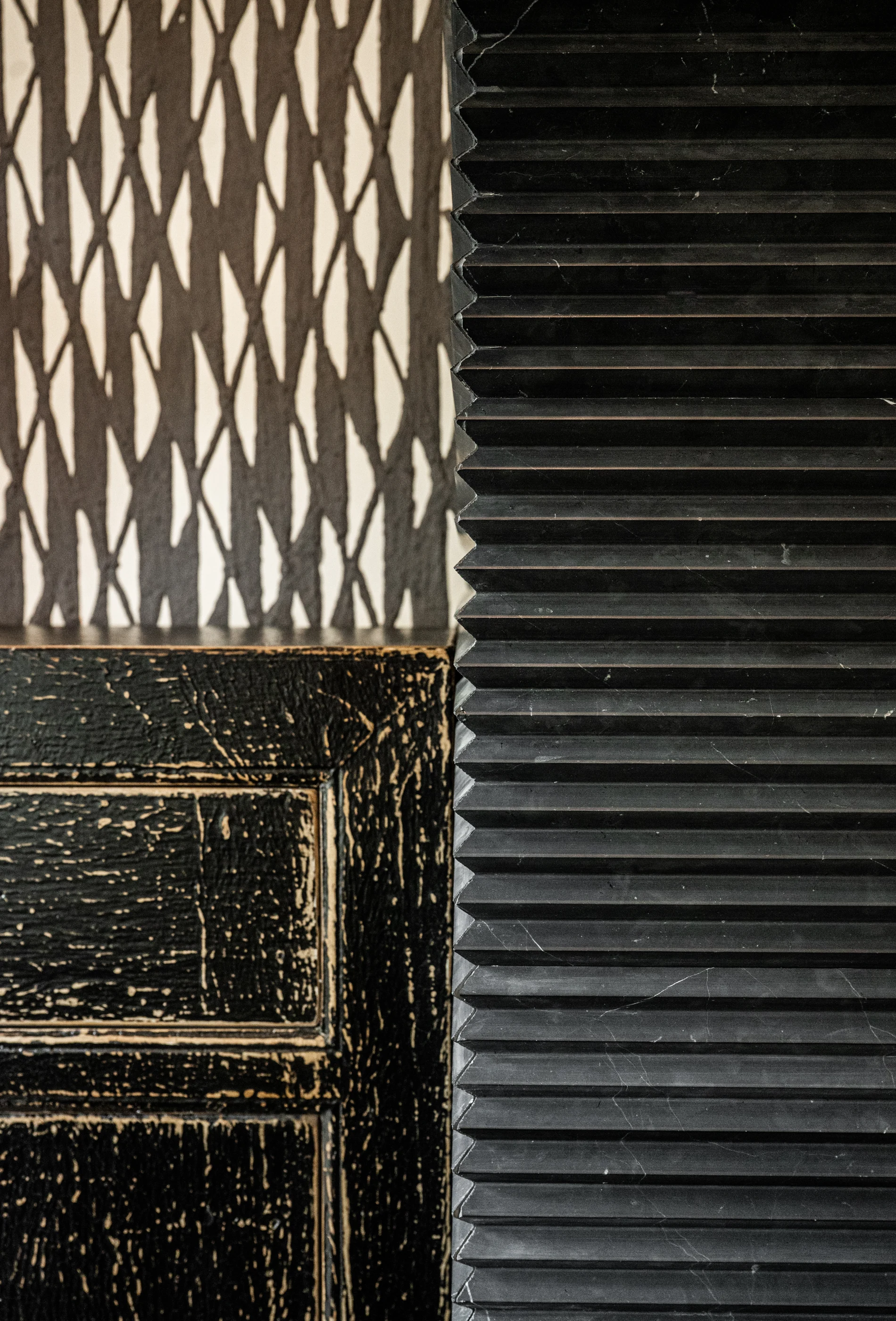 Textured dark fireplace surround at Hart Townhouse.