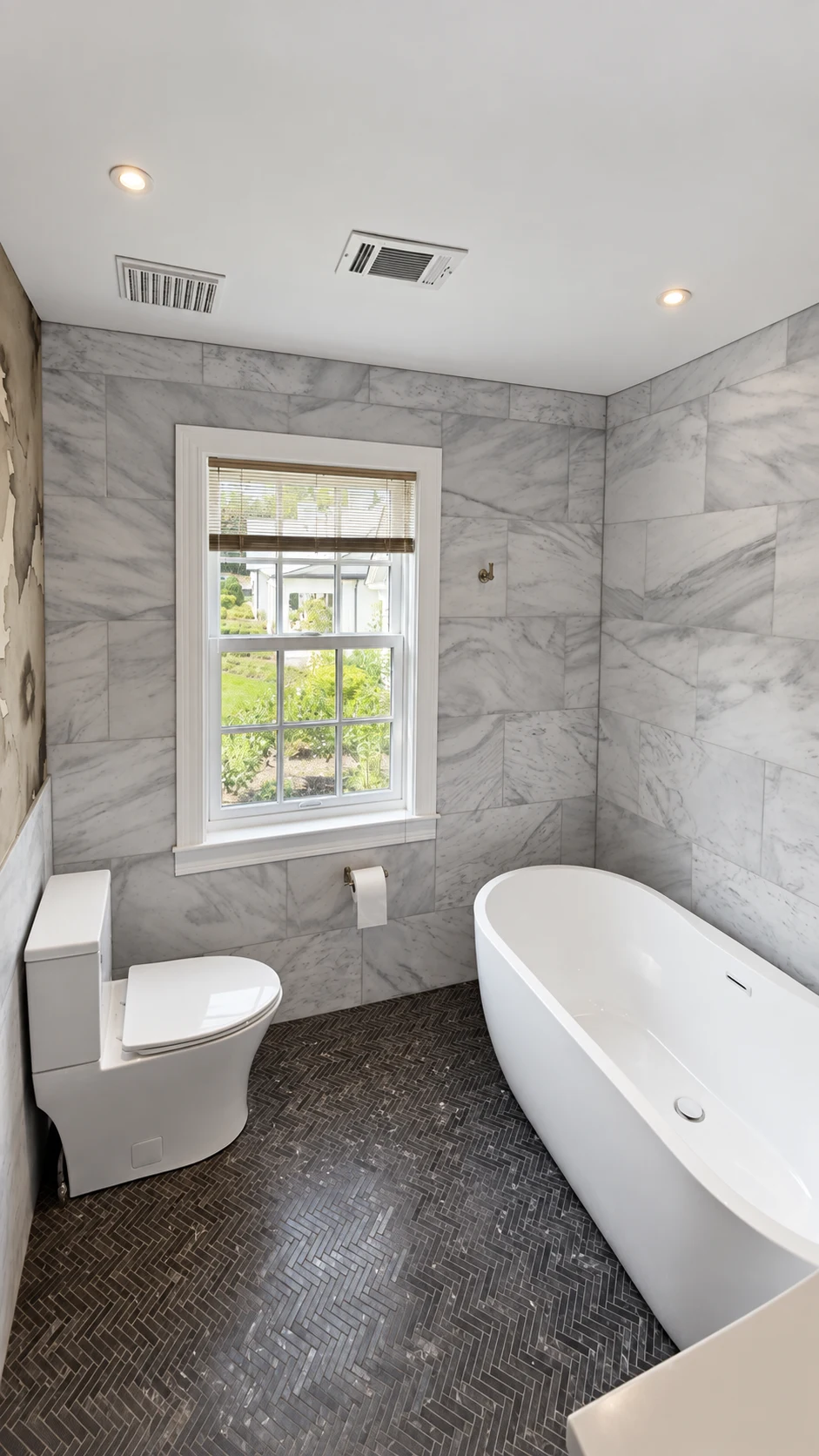 Freestanding bathtub and softly lit bathroom at Lakeside.