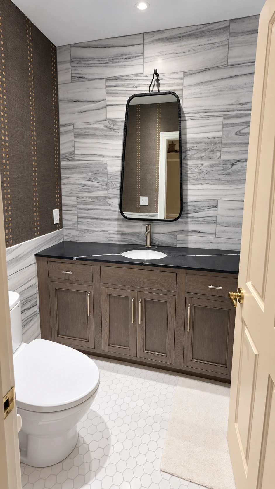 Lakeside powder room with sculptural fixtures and expressive finishes.