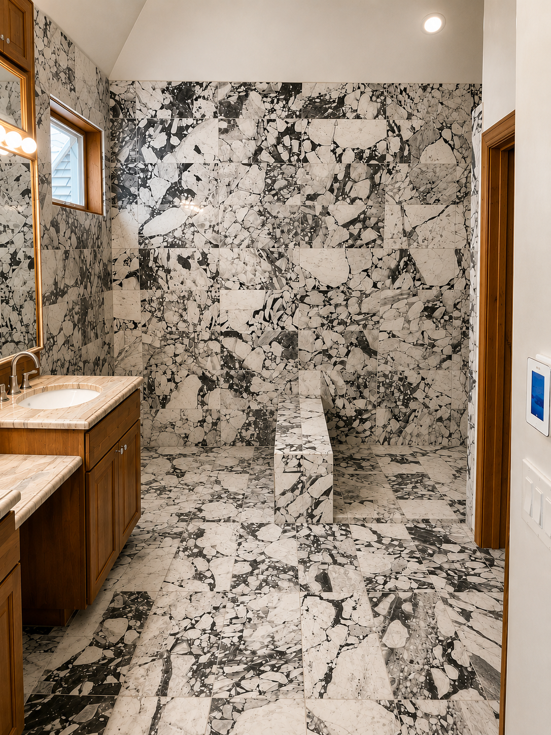 Bold-veined marble shower walls and bench