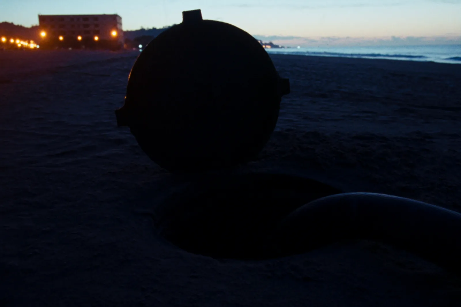 Cable landing station on a quiet coast at dusk on a Mediterranean shore