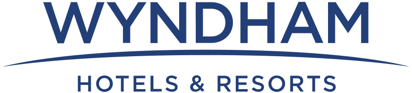 Wyndham Hotels & Resorts logo in blue with an arc element below the name.