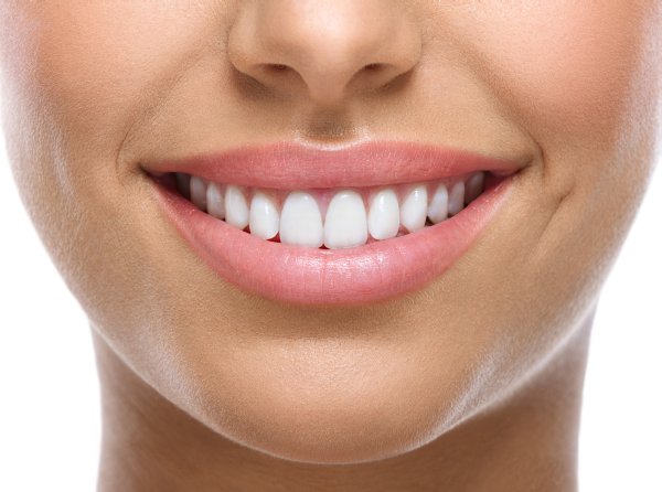 Close-up of a warm smile with healthy white teeth, welcome to Genuine Care Dental in Saratoga, CA