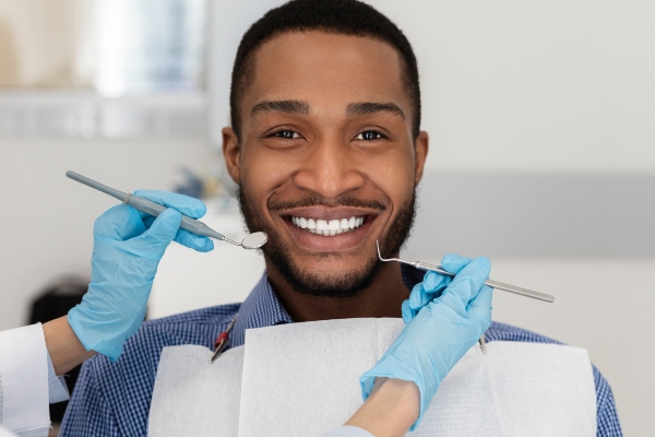 Choosing Between Dental Implants and Dentures from Genuine Care Dental in Saratoga, CA