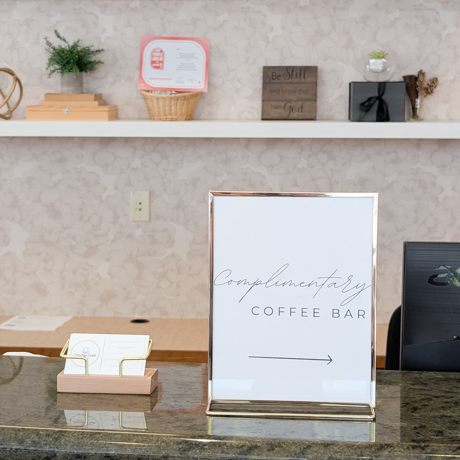 Complimentary coffee bar sign at the front desk of Genuine Care Dental, a dental office in Saratoga, CA