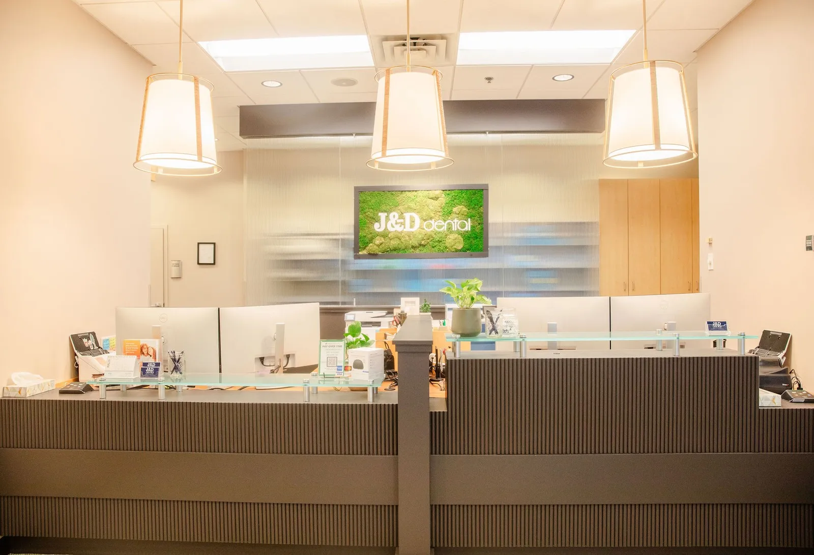 J & D Dental reception desk with hanging lights