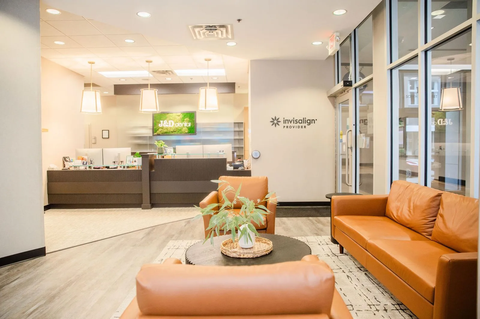 J & D Dental reception lobby with leather seating and front desk