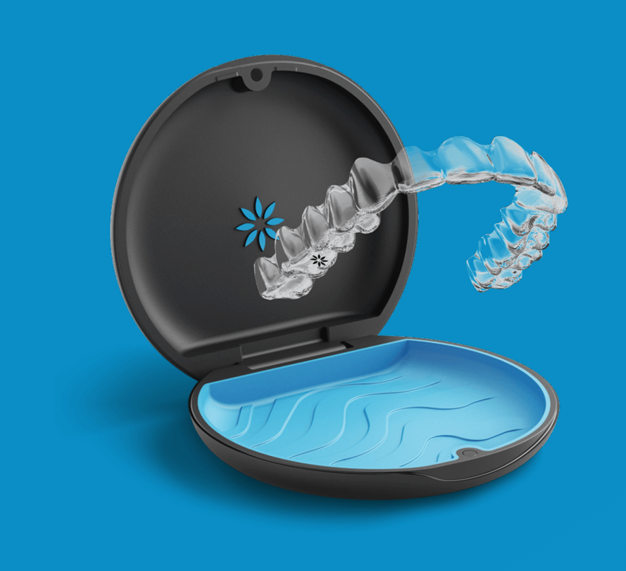 Open Invisalign case with a clear aligner tray on a blue background