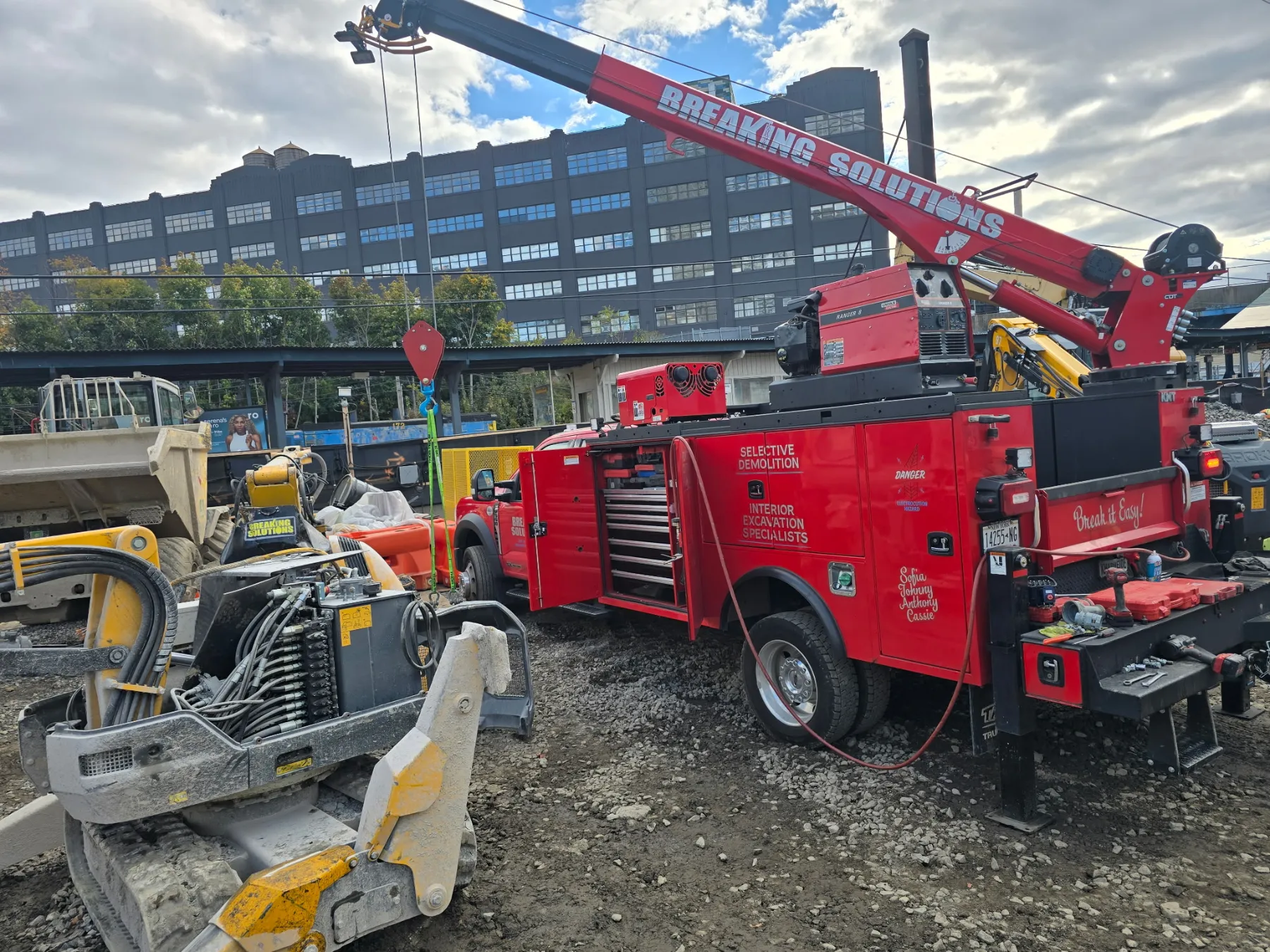 BSI service truck with crane servicing a Brokk on site