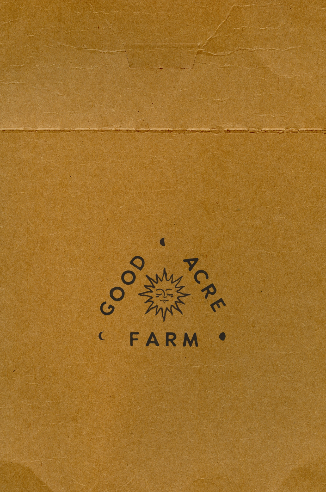 Good Acre Farm stamp printed on textured brown card