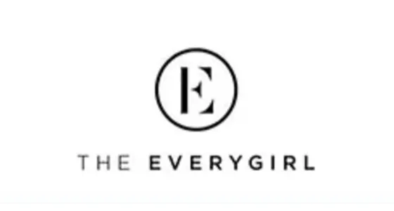 The Everygirl logo with a stylized E enclosed in a circle above the text 'THE EVERYGIRL'.