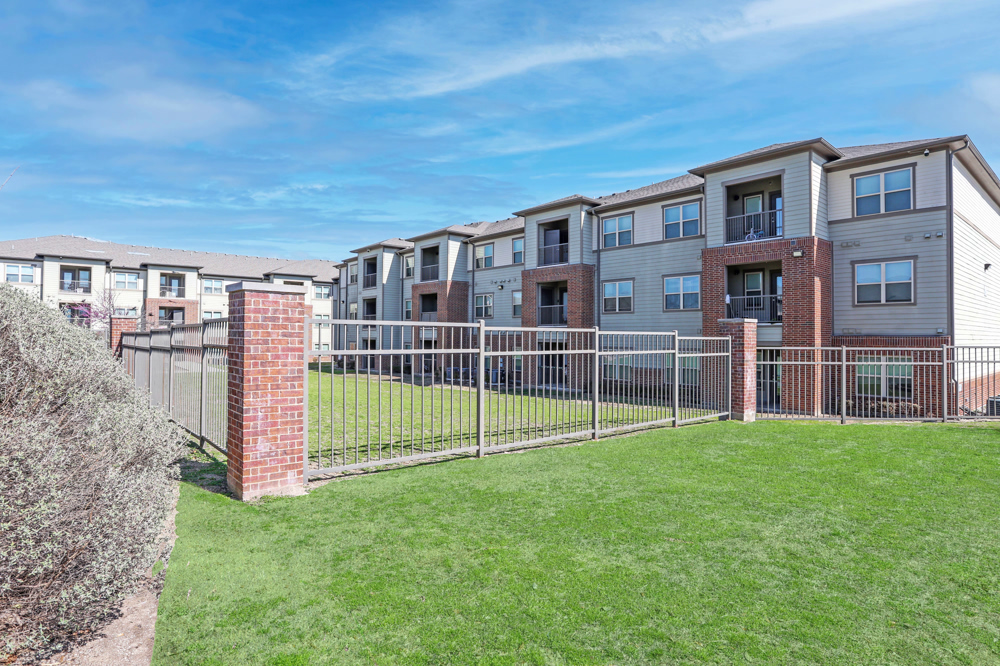 Exterior of property buildings surrounded by fence