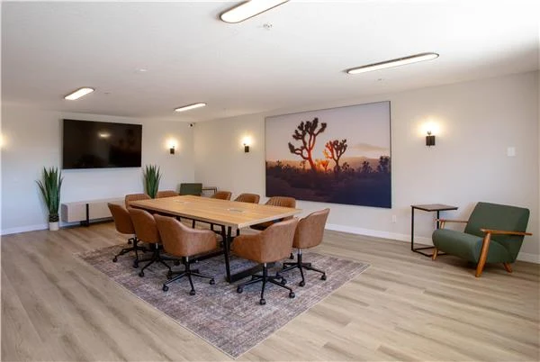 Corporate meeting room at Kokopelli Inn Sedona with conference table and lounge seating