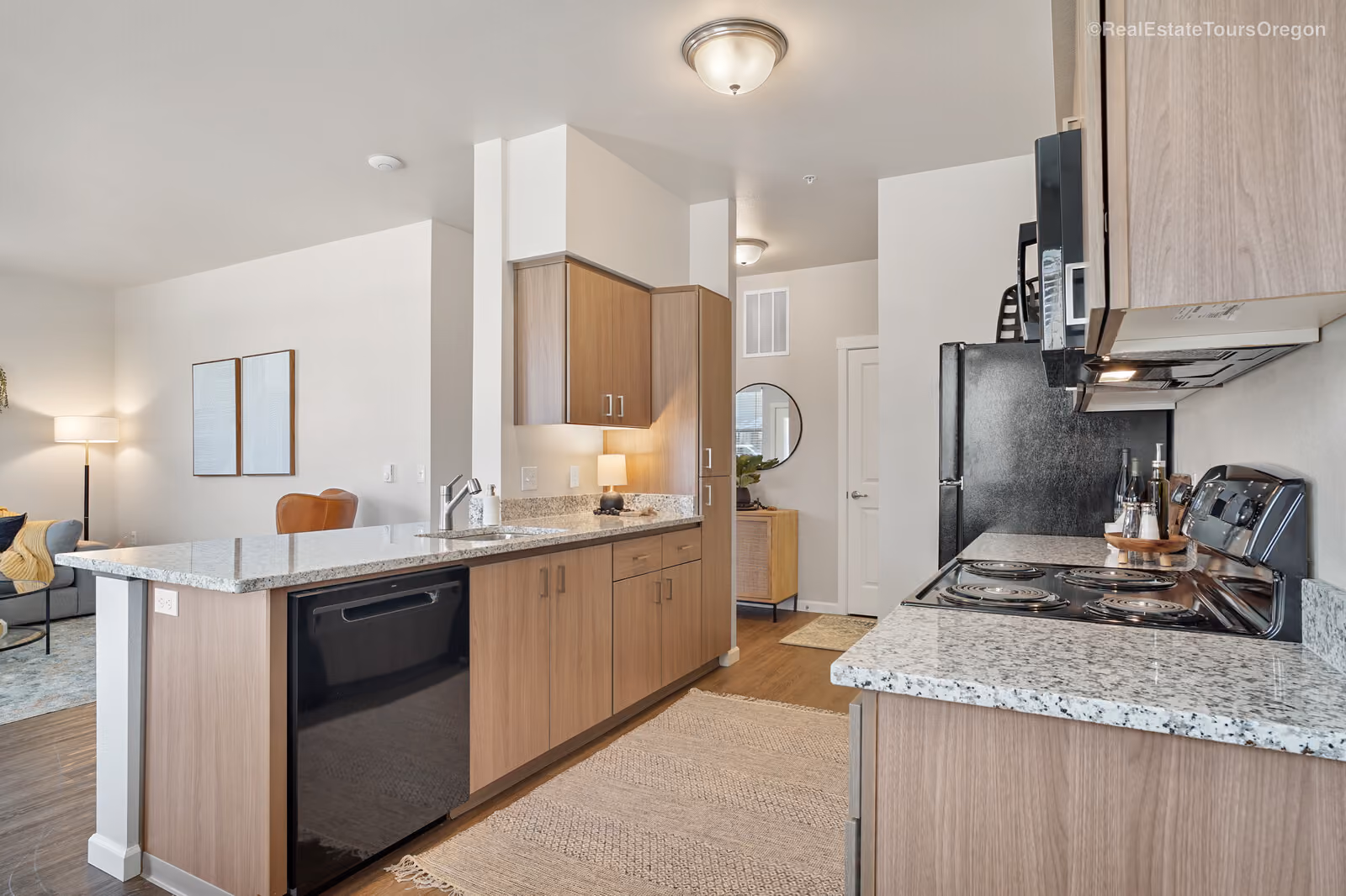 Kitchen with wood style floors at The Jory Apartments in Salem, Oregon