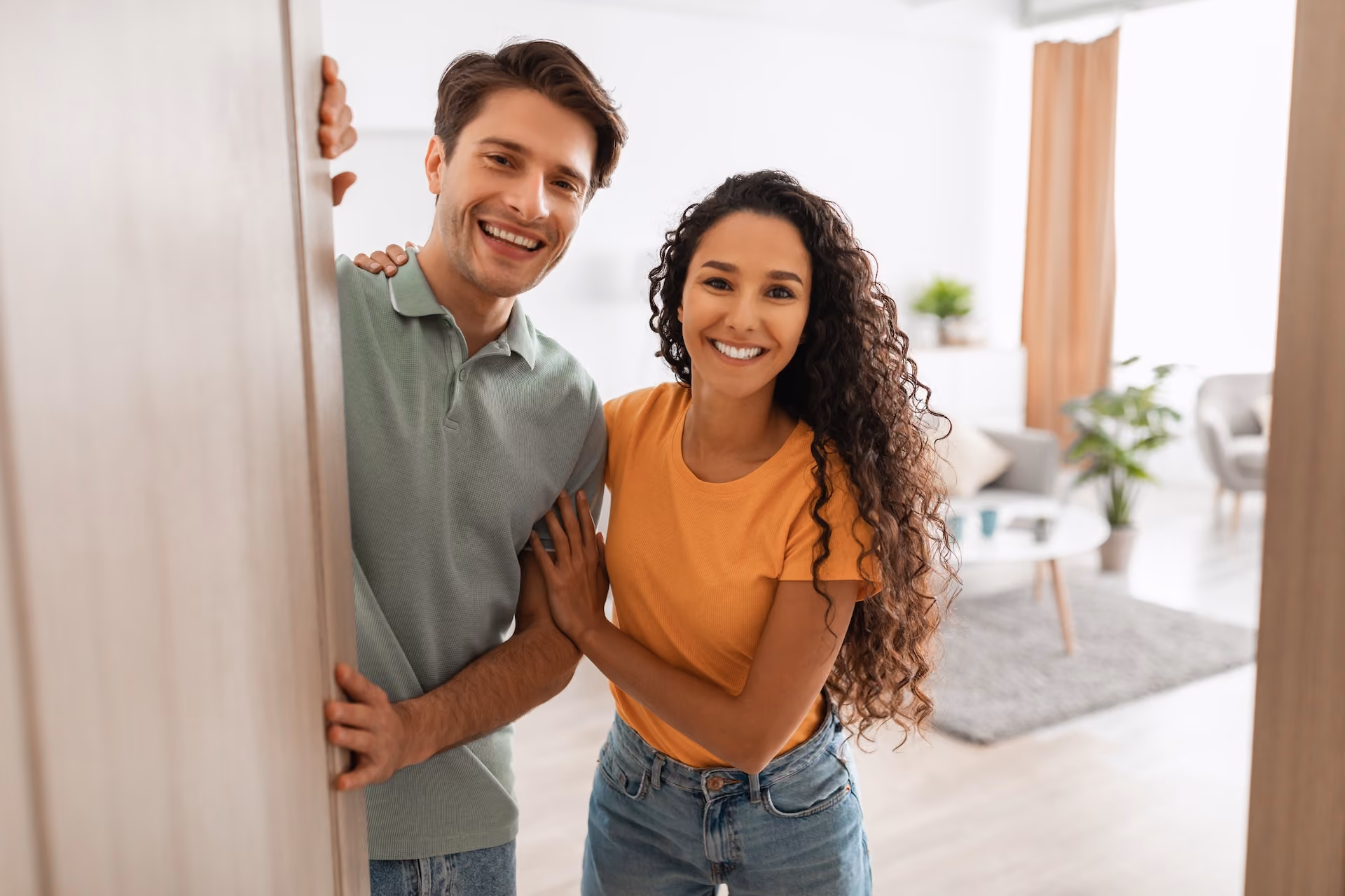 Couple opening apartment door
