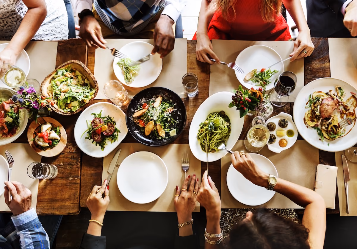 People eating food around table