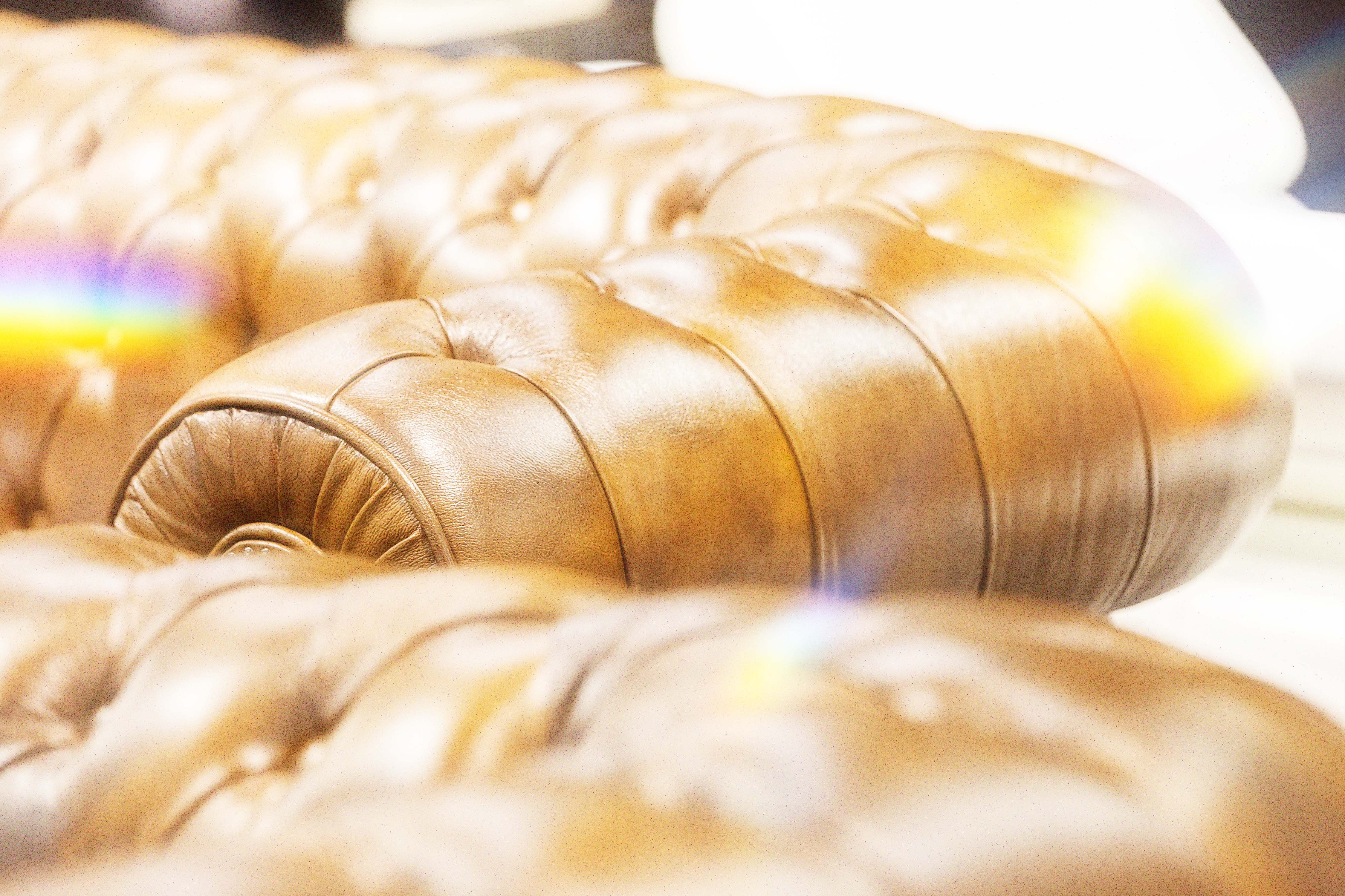 Tufted caramel leather upholstery
