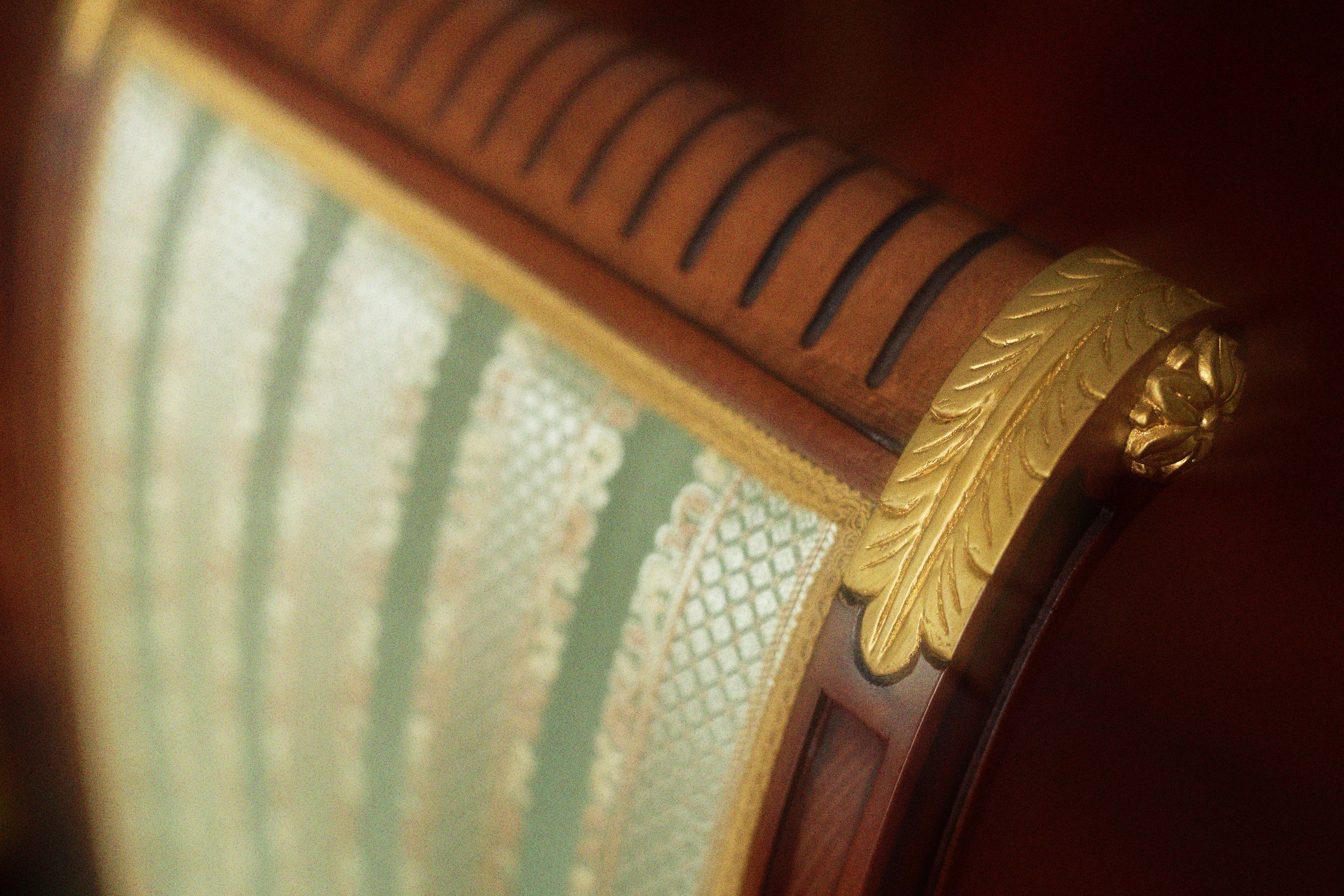 Antique chair with a gold leaf ornament