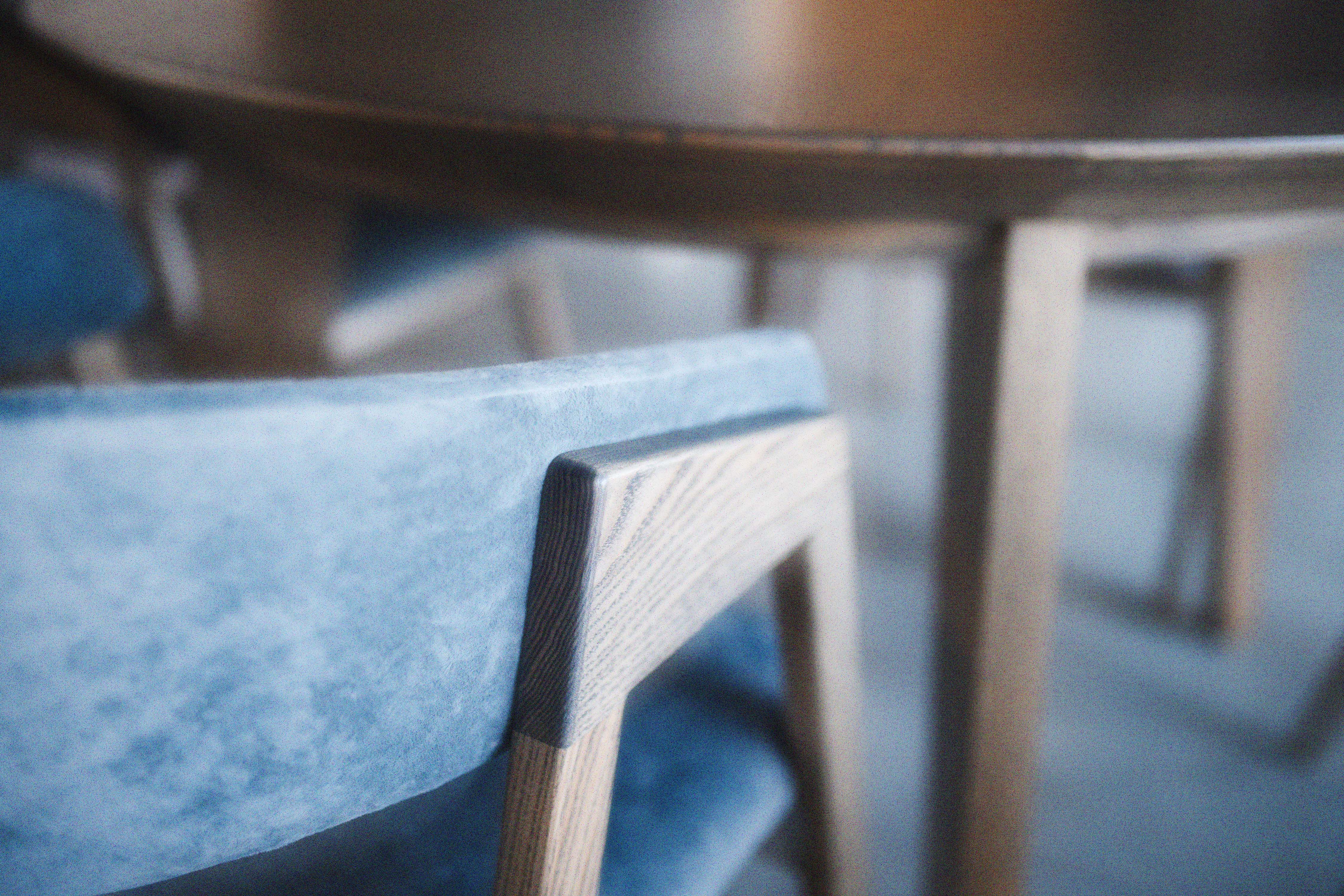 Light blue upholstered wooden chair