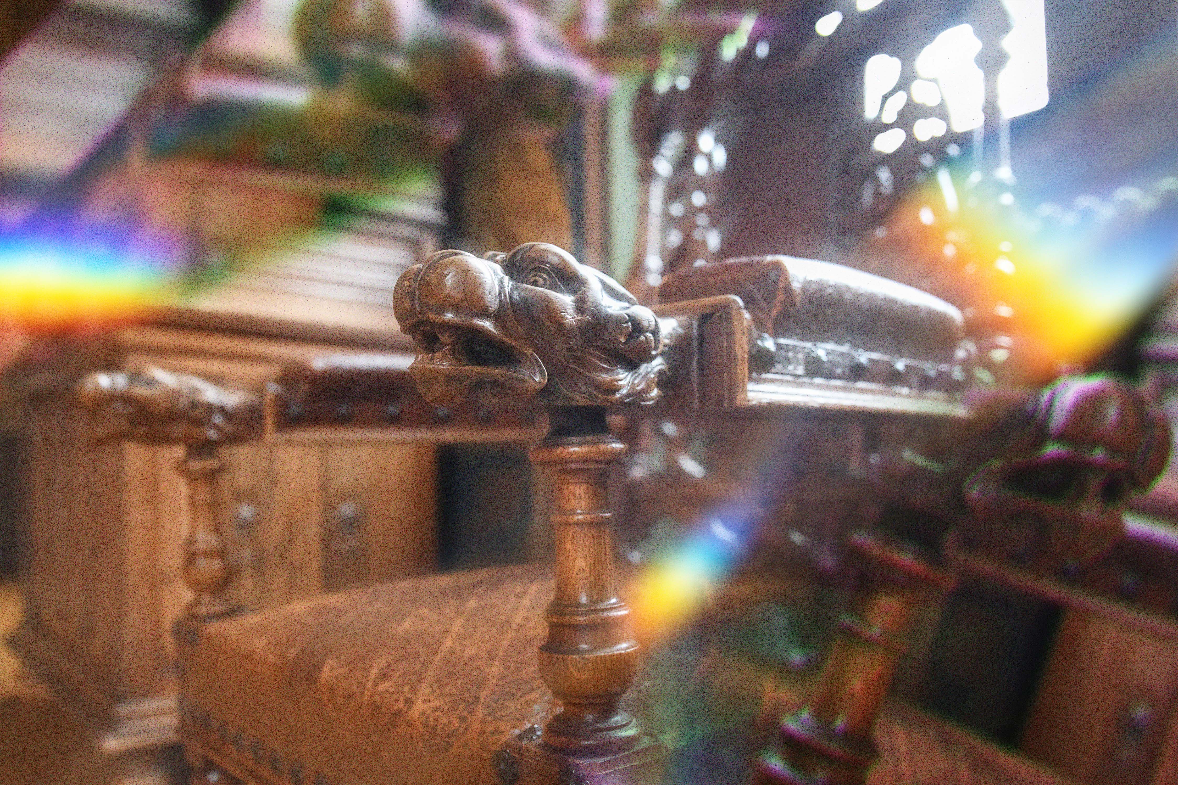 Carved wooden chair arm