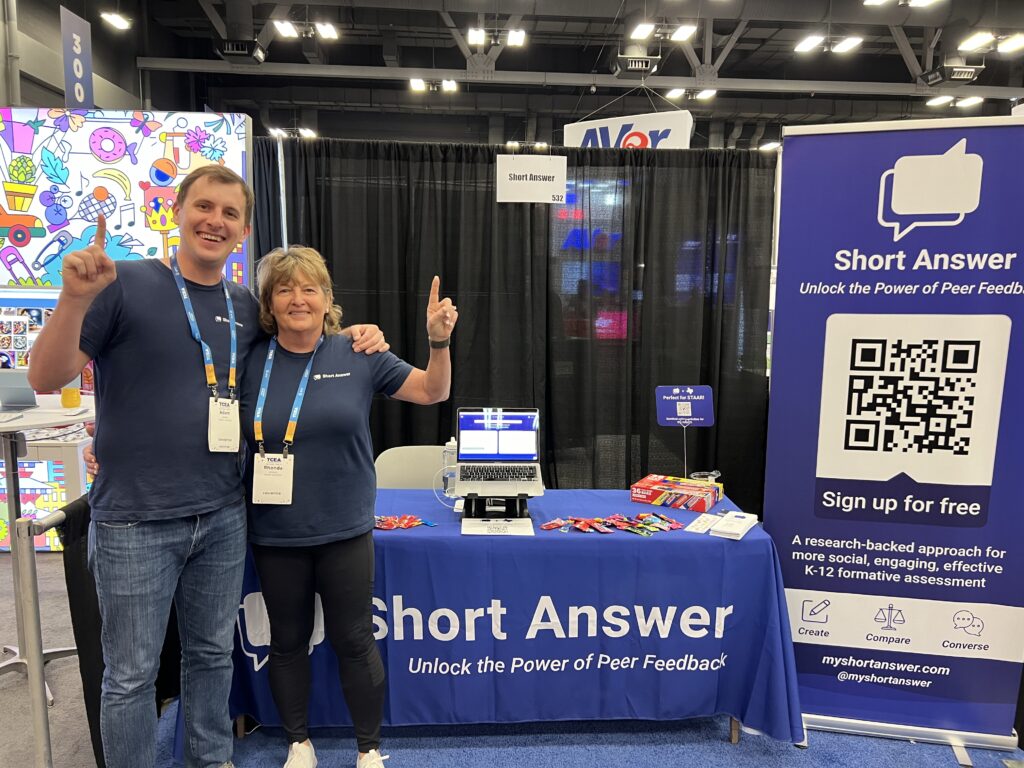 Adam and Rhonda Sparks smiling at the Short Answer booth at TCEA