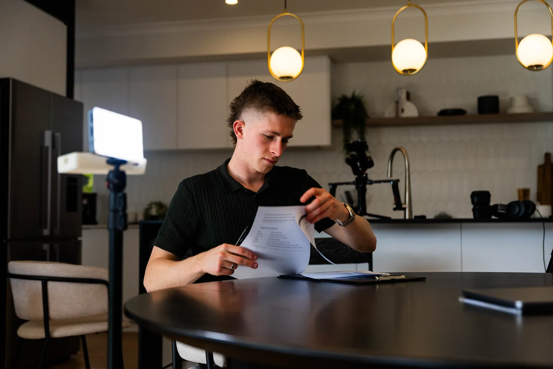 Keoni going through notes before a shoot.